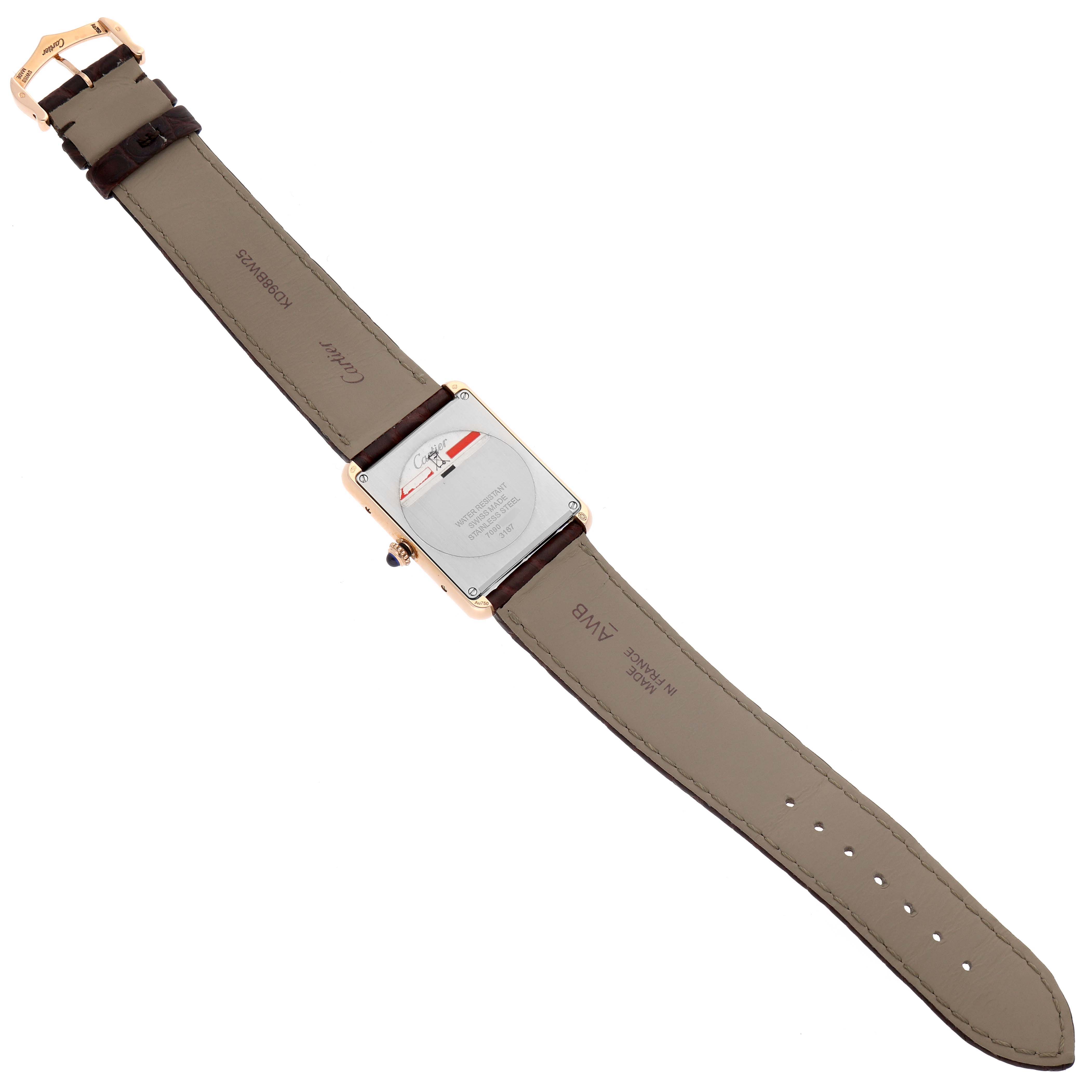 The image shows the back view of a Cartier Tank Solo W5200025 Men's Steel and Gold (two tone) Silver Dial W5200025 Men's Steel and Gold (two tone) Silver Dial watch, clearly displaying its case back and leather straps.