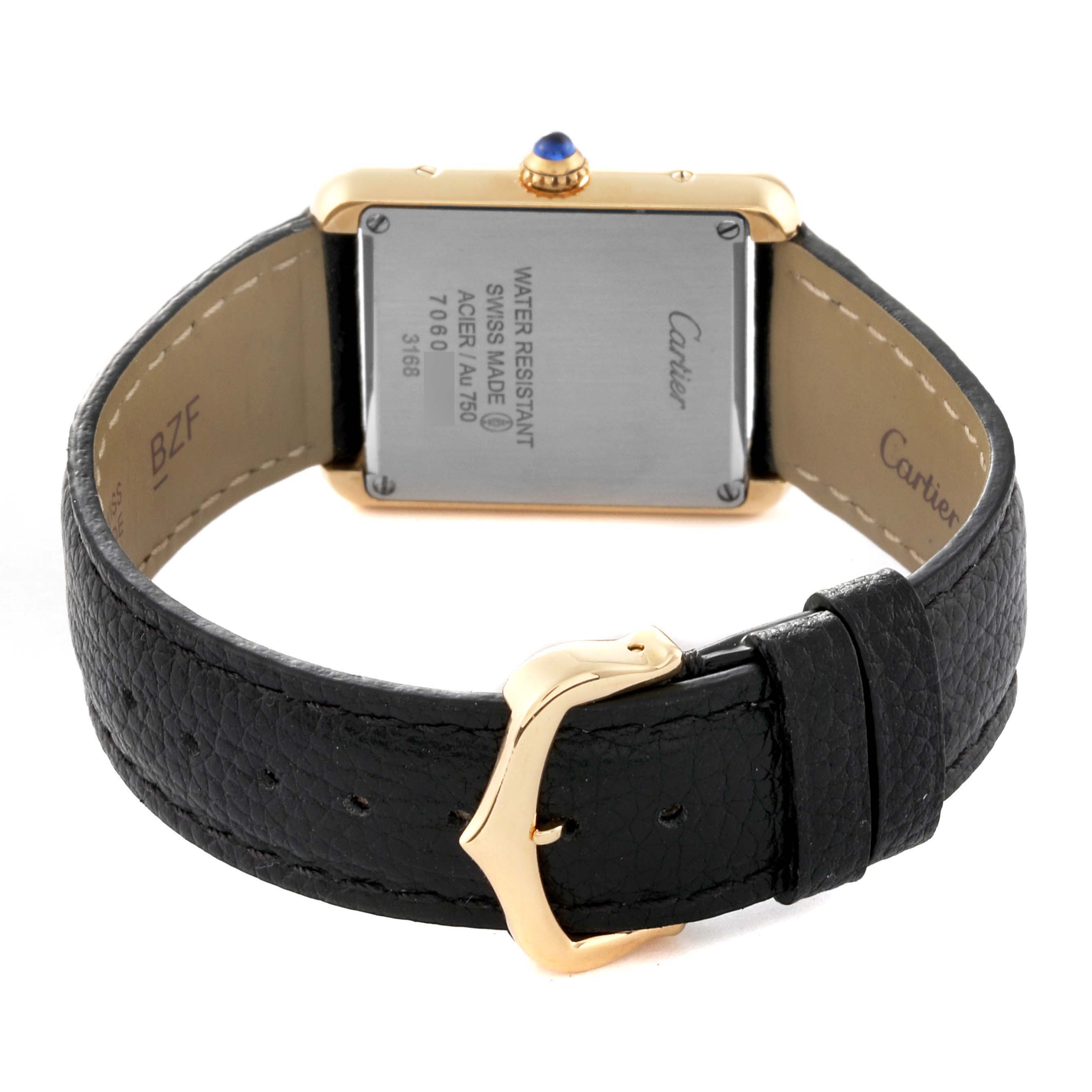 The image shows the back case and leather strap of the Cartier Tank Solo W5200002 Women's Steel and Gold (two tone) Silver Dial W5200002 Women's Steel and Gold (two tone) Silver Dial watch, highlighting the buckle and case back details.