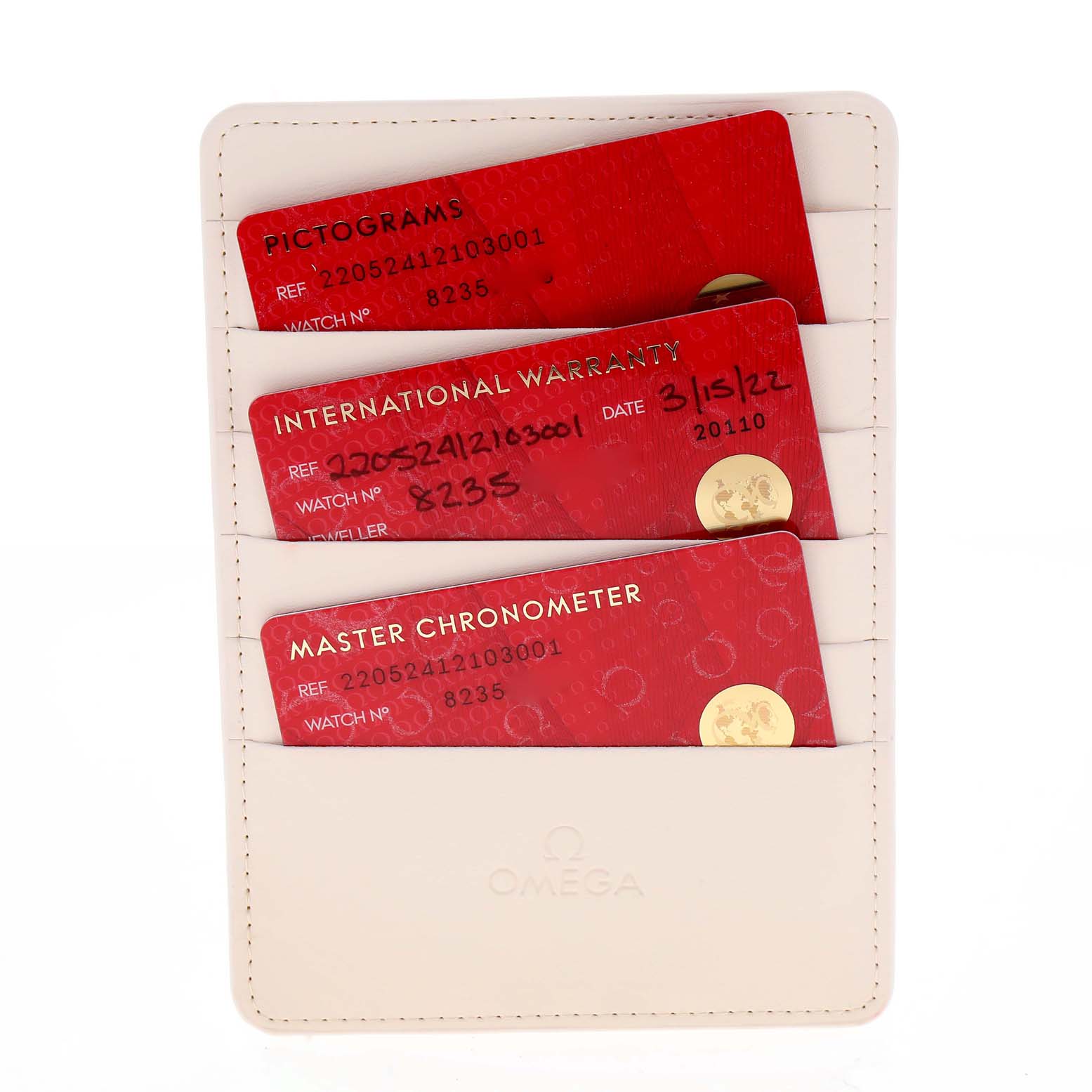 The image shows three red Omega Aqua Terra 220.52.41.21.03.001 Men's Rose Gold Blue Dial 220.52.41.21.03.001 Men's Rose Gold Blue Dial model cards in a white wallet, indicating pictograms, international warranty, and master chronometer certification.