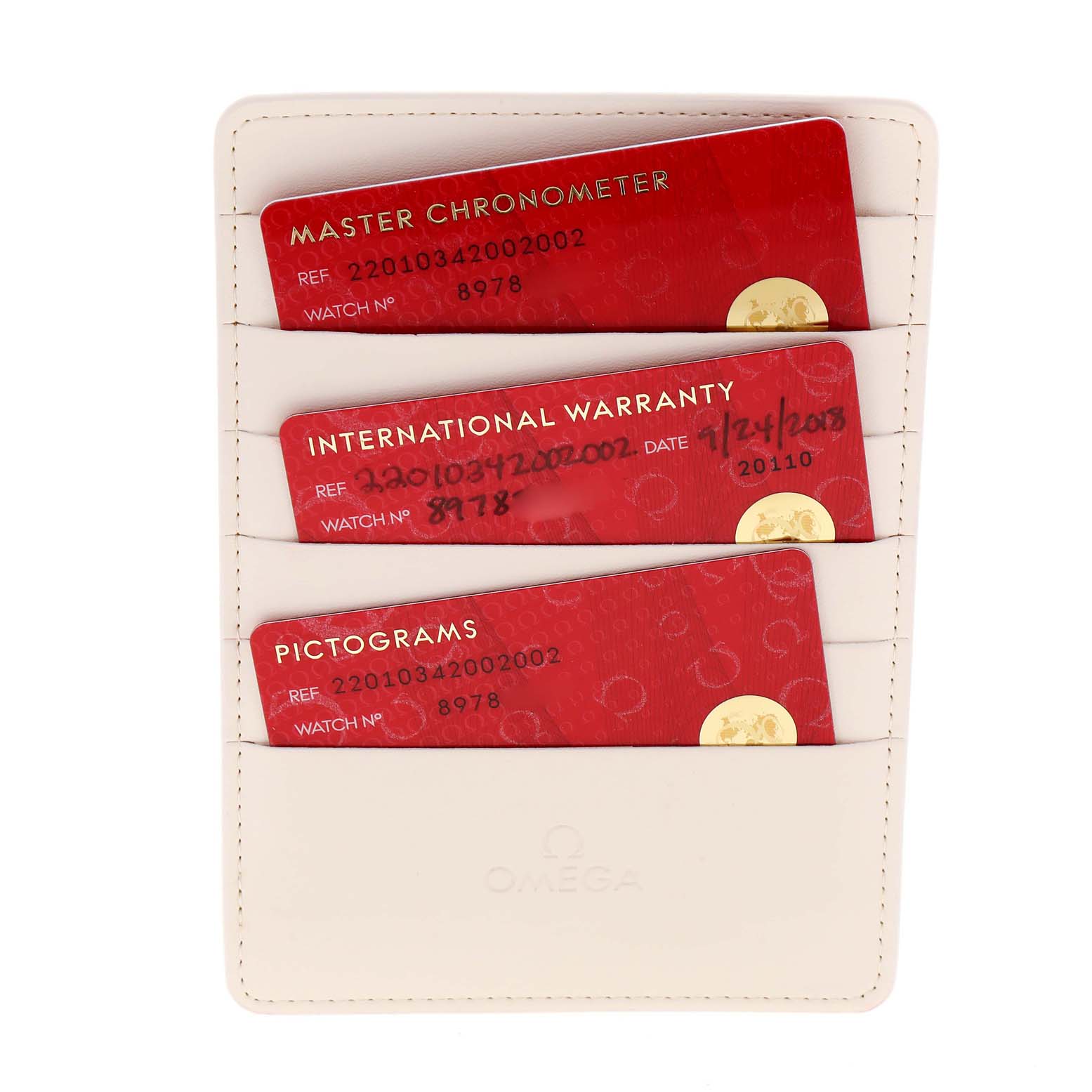 This image shows the warranty cards for the Omega 220.10.34.20.02.002 Women
s Stainless Steel Silver Dial 220.10.34.20.02.002 Women
s Stainless Steel Silver Dial Seamaster Aqua Terra Steel Ladies Watch 220.10.34.20.02.002 in a holder.