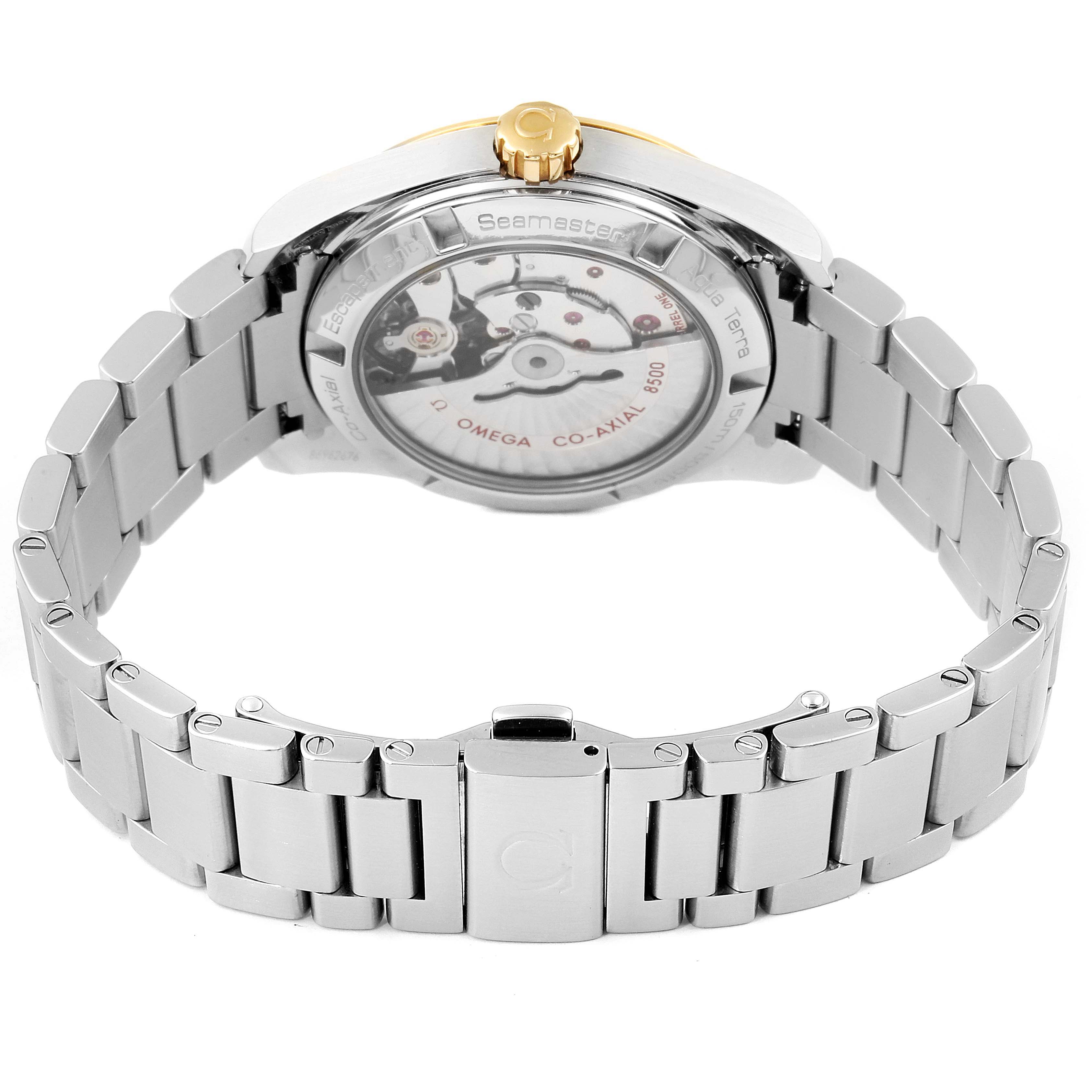 The image shows the back view of the Omega Aqua Terra 231.20.39.21.06.004 Men's Steel and Gold (two tone) Grey Dial 231.20.39.21.06.004 Men's Steel and Gold (two tone) Grey Dial watch, highlighting its open case back mechanism and silver bracelet.