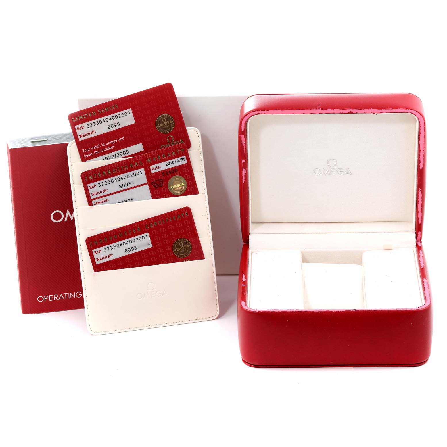 The image shows the box, warranty cards, and manual for the Omega Speedmaster 323.30.40.40.02.001 Men's Stainless Steel White Dial 323.30.40.40.02.001 Men's Stainless Steel White Dial watch.