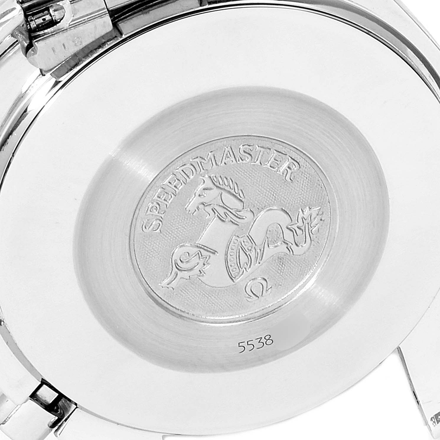 The image shows the backside of an Omega Speedmaster 3510.61.00 Men's Stainless Steel Red Dial 3510.61.00 Men's Stainless Steel Red Dial watch, highlighting the engraved logo and text.