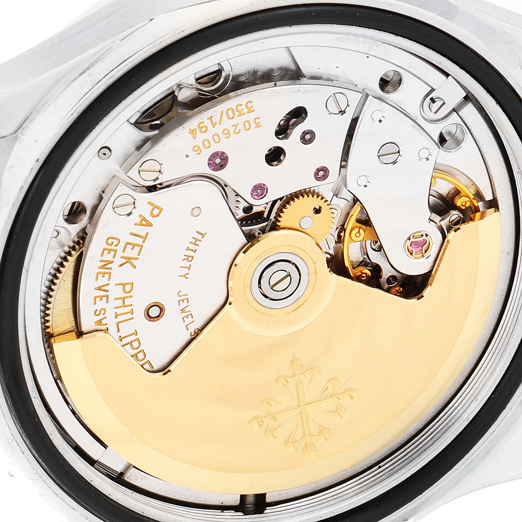 The image shows the back view of the Patek Philippe Aquanaut 5066A Men
s Stainless Steel Black Dial 5066A Men
s Stainless Steel Black Dial watch, revealing its intricate mechanical movement.