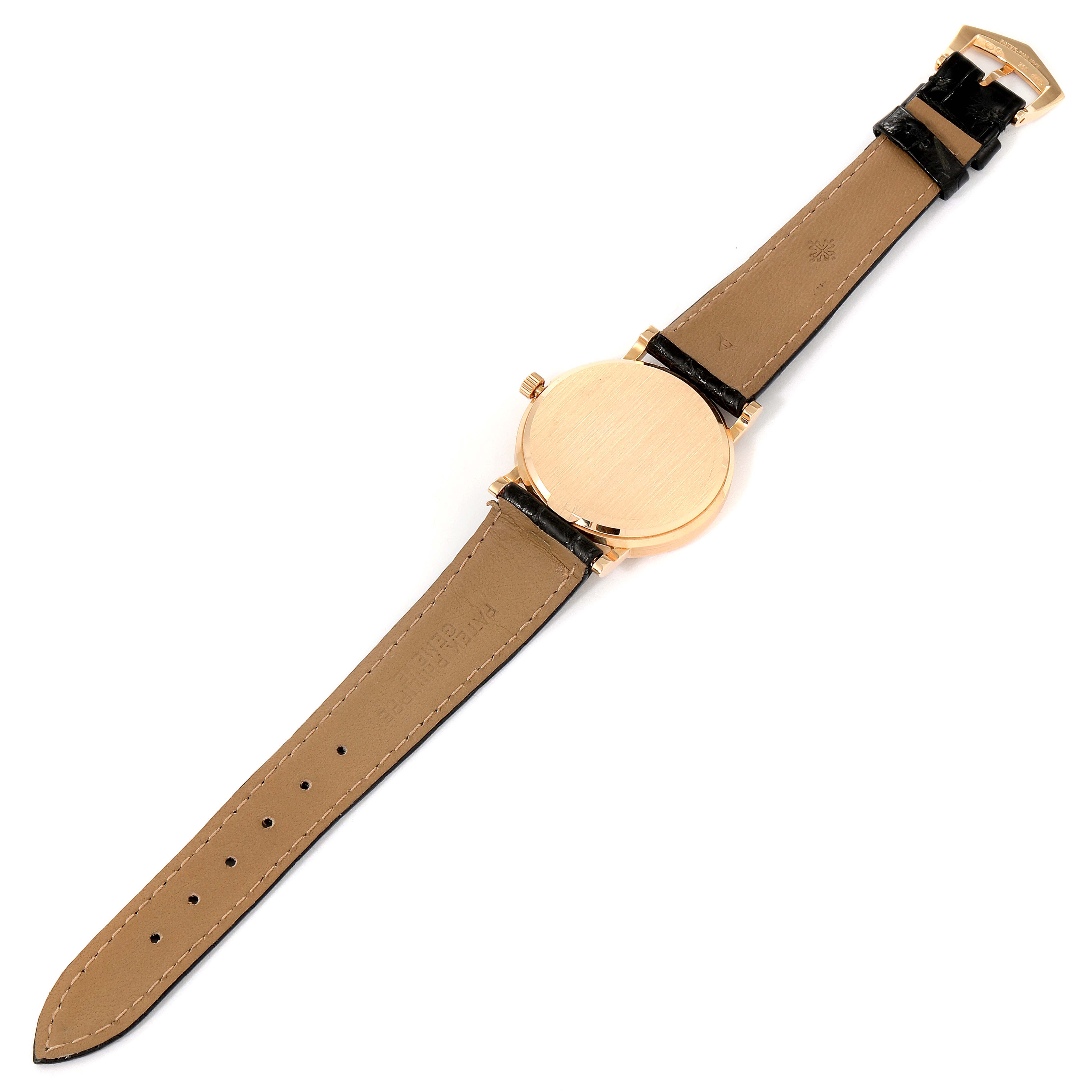 The Patek Philippe Calatrava 3802 Men's Rose Gold Beige Dial 3802 Men's Rose Gold Beige Dial watch is shown from the back, displaying its case, strap, and buckle.