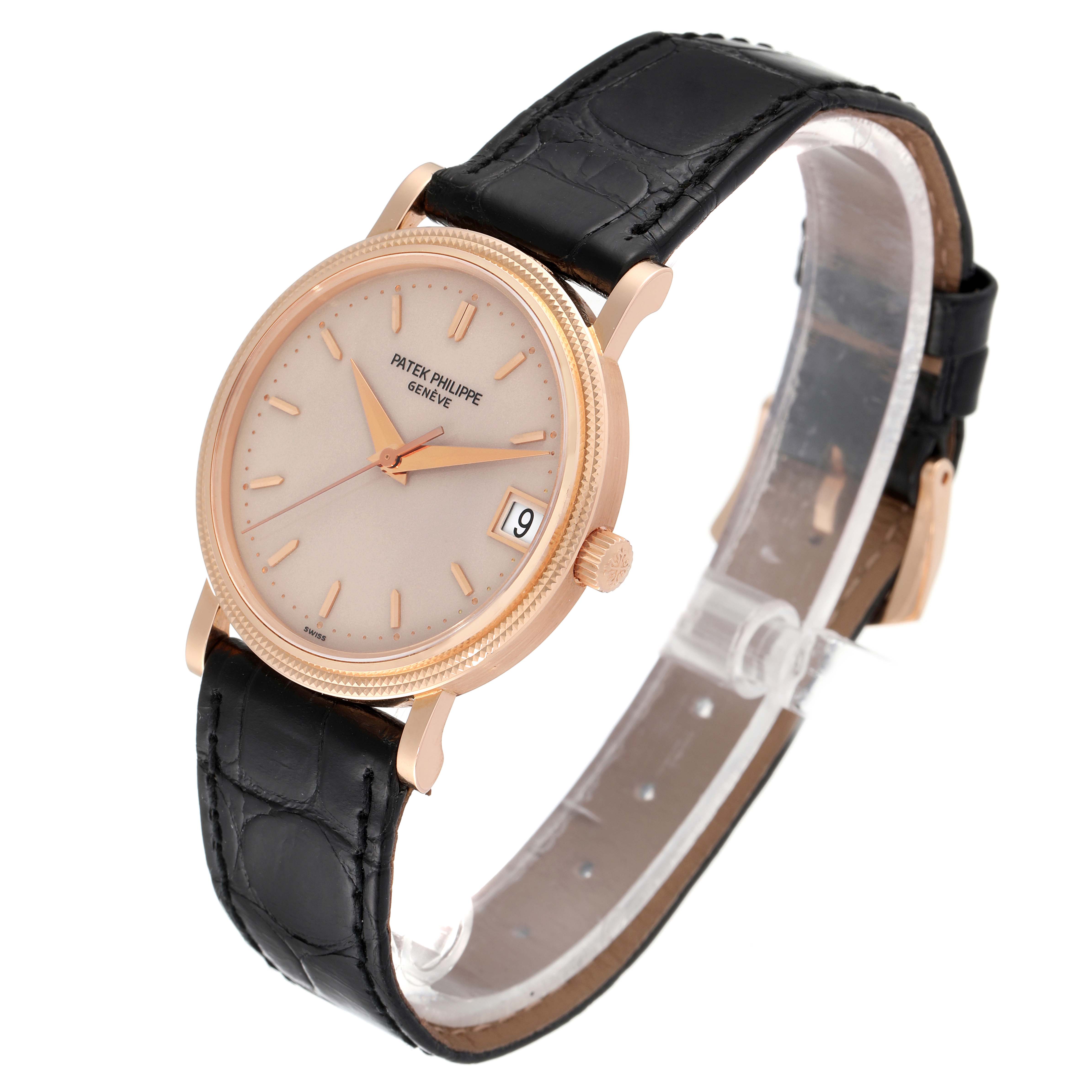 The image shows a Patek Philippe Calatrava 3802 Men's Rose Gold Beige Dial 3802 Men's Rose Gold Beige Dial watch at a front-side angle, highlighting its dial, hands, date window, and black leather strap.