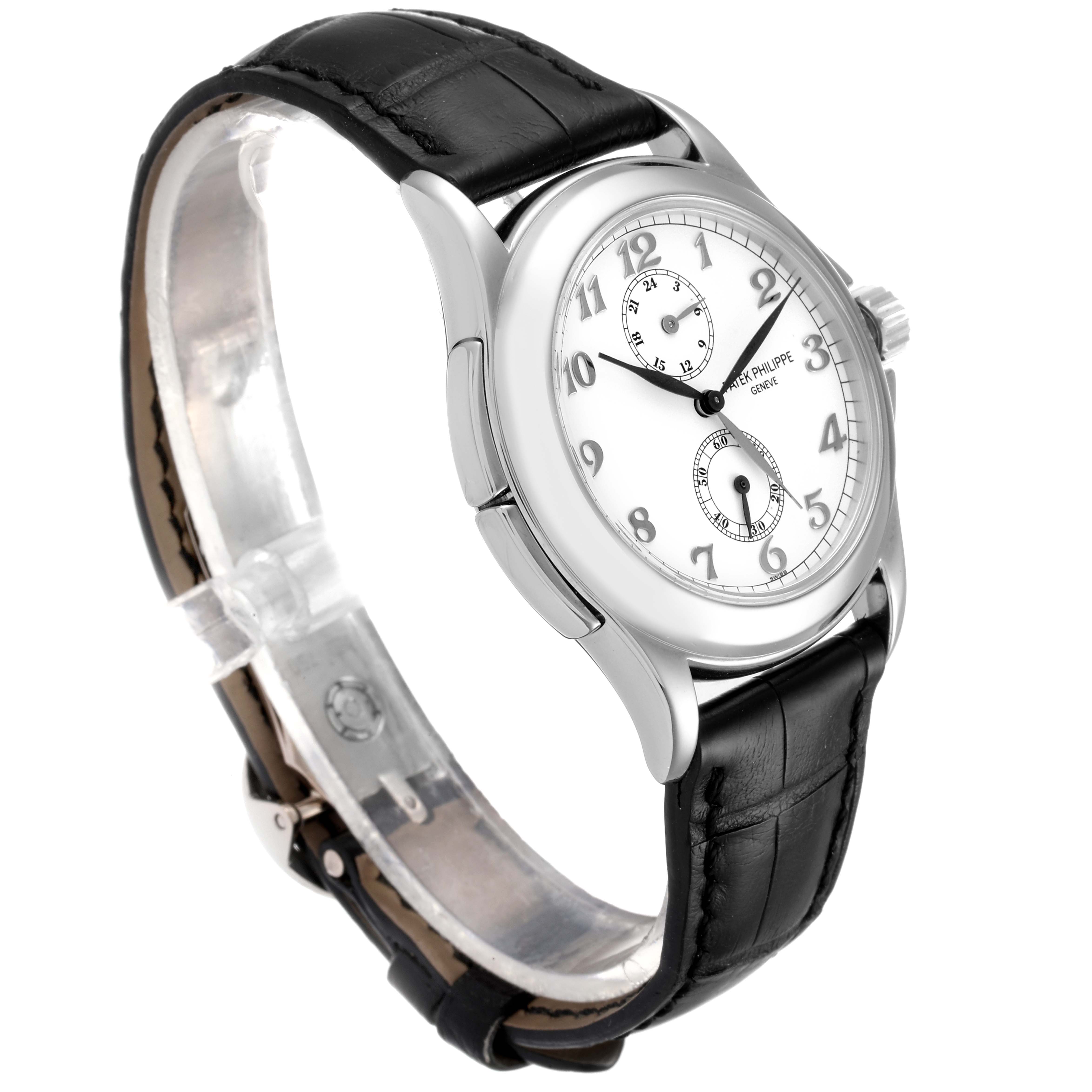 The Patek Philippe Calatrava 5134G Men's White Gold White Dial 5134G Men's White Gold White Dial watch is shown at a side angle, highlighting its white dial, Arabic numerals, sub-dials, and black leather strap.