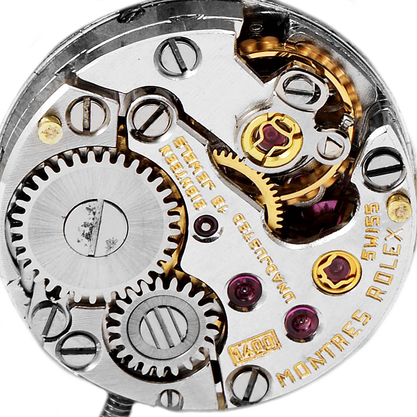 The image shows the intricate internal mechanism and gears of a Rolex Cocktail  Women's Yellow Gold Silver Dial  Women's Yellow Gold Silver Dial model watch viewed from the back.