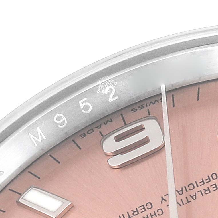 The image shows a close-up of the Rolex Air-King 114200 Men's Stainless Steel Pink Dial 114200 Men's Stainless Steel Pink Dial watch, specifically highlighting the edge of the dial and part of the bezel displaying "M952".