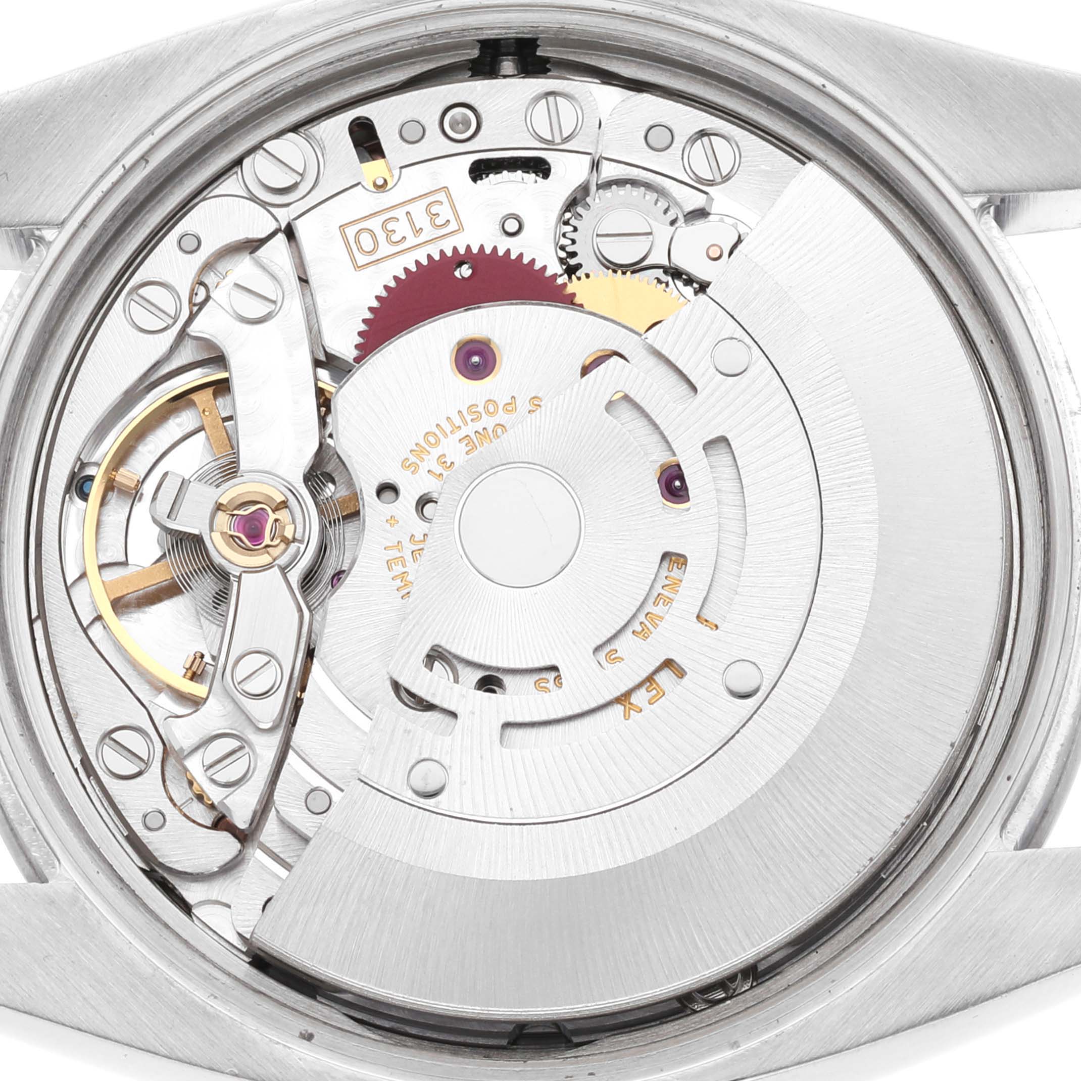 This image shows the internal mechanism of a Rolex Air-King 114200 Men's Stainless Steel Pink Dial 114200 Men's Stainless Steel Pink Dial watch from the back angle, highlighting its intricate parts and movement.