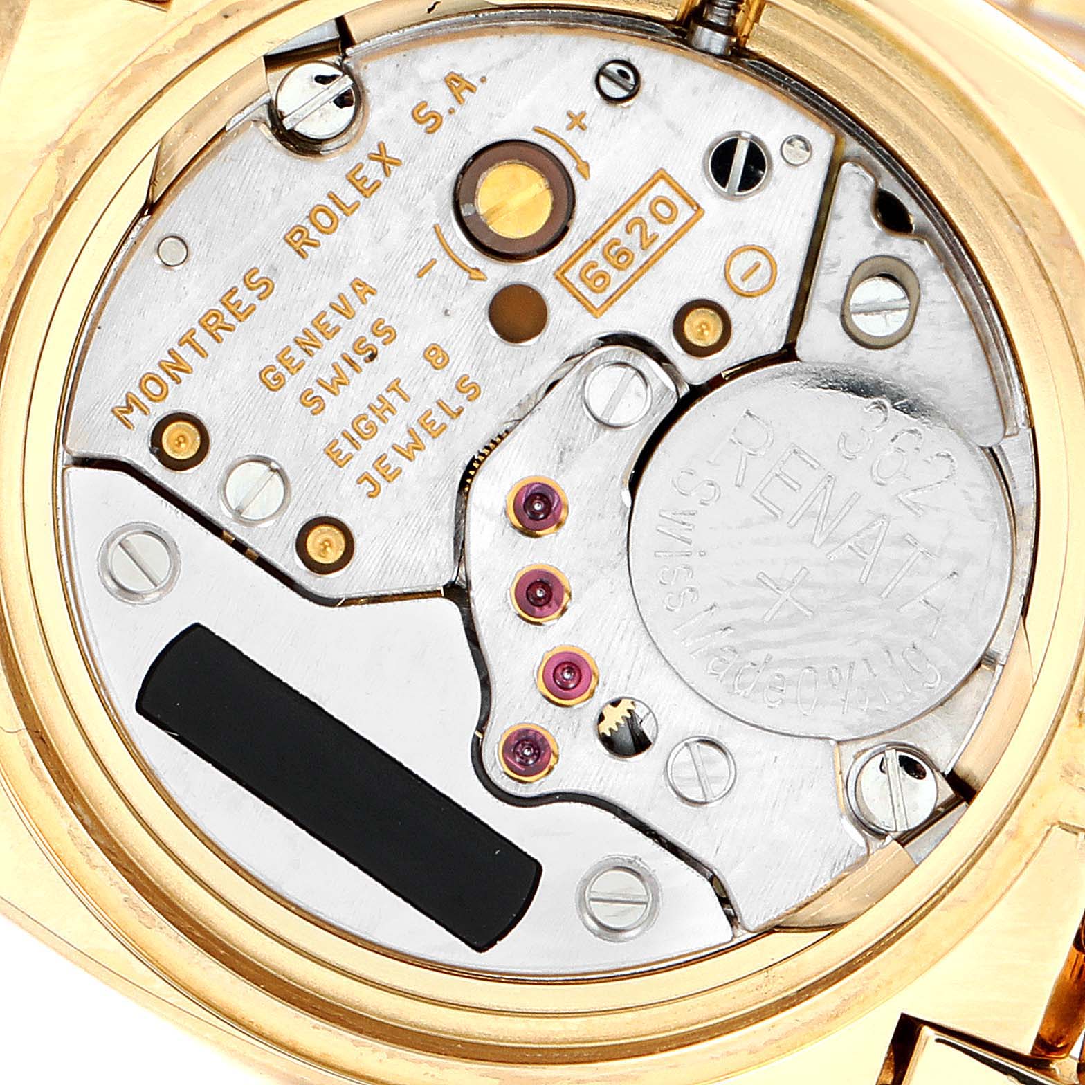 The image of the Rolex Cellini 6311 Women's Yellow Gold White Dial 6311 Women's Yellow Gold White Dial shows the internal movement, highlighting gears, jewels, and the battery from a top-down angle.