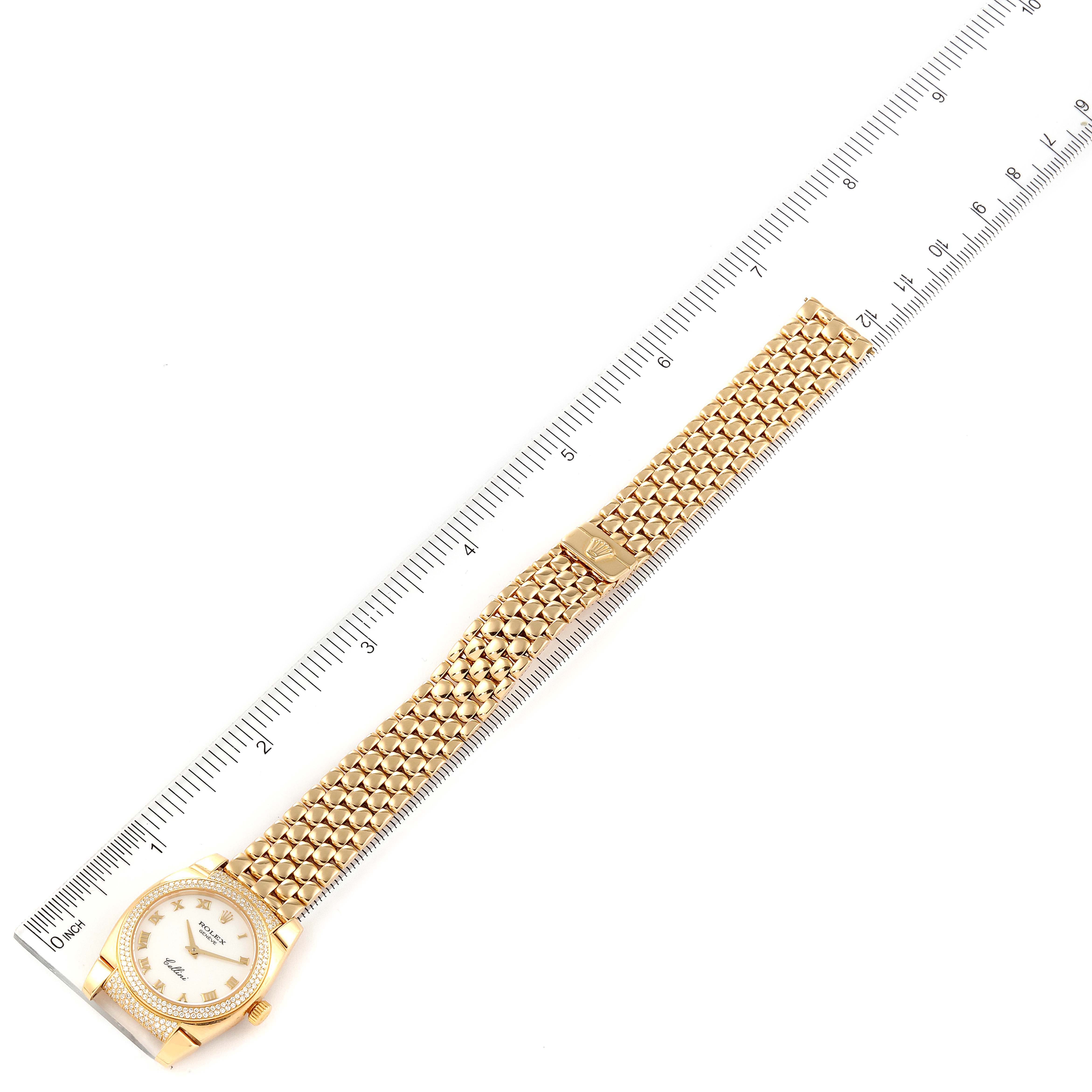 The Rolex Cellini 6311 Women's Yellow Gold White Dial 6311 Women's Yellow Gold White Dial watch is shown from a top-down angle, displaying the full dial, bracelet, and a ruler for size reference.