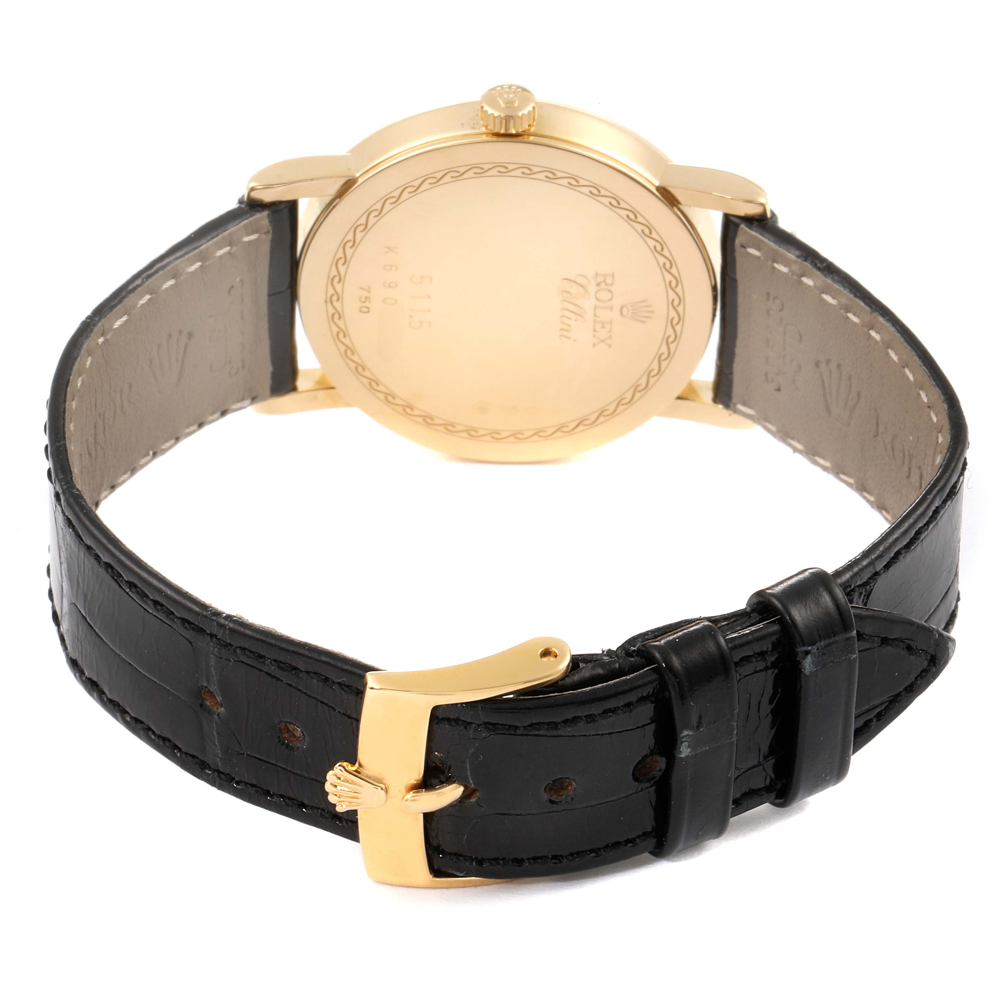 The image shows the back and strap of a Rolex Cellini 5115 Men's Yellow Gold Black Dial 5115 Men's Yellow Gold Black Dial watch, highlighting the gold case, clasp, and black leather band.