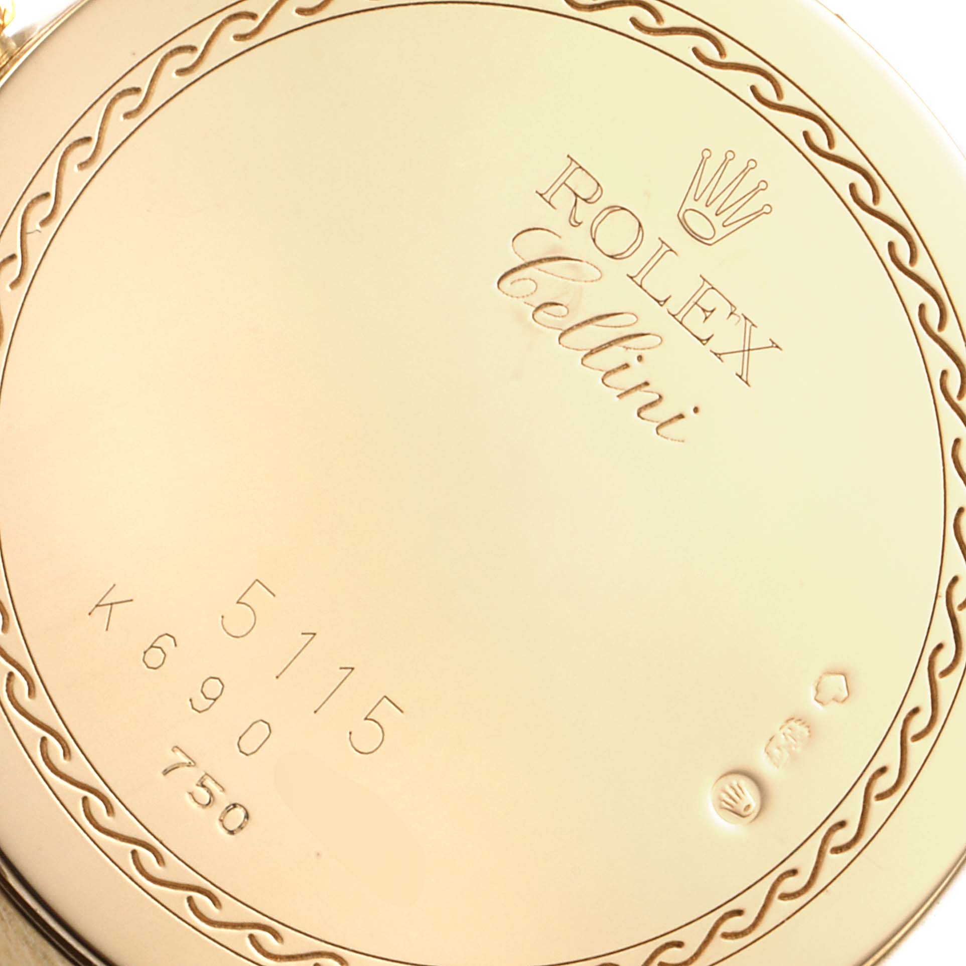 The image shows the back of a Rolex Cellini 5115 Men's Yellow Gold Black Dial 5115 Men's Yellow Gold Black Dial watch, displaying its model 5115 and various engravings.