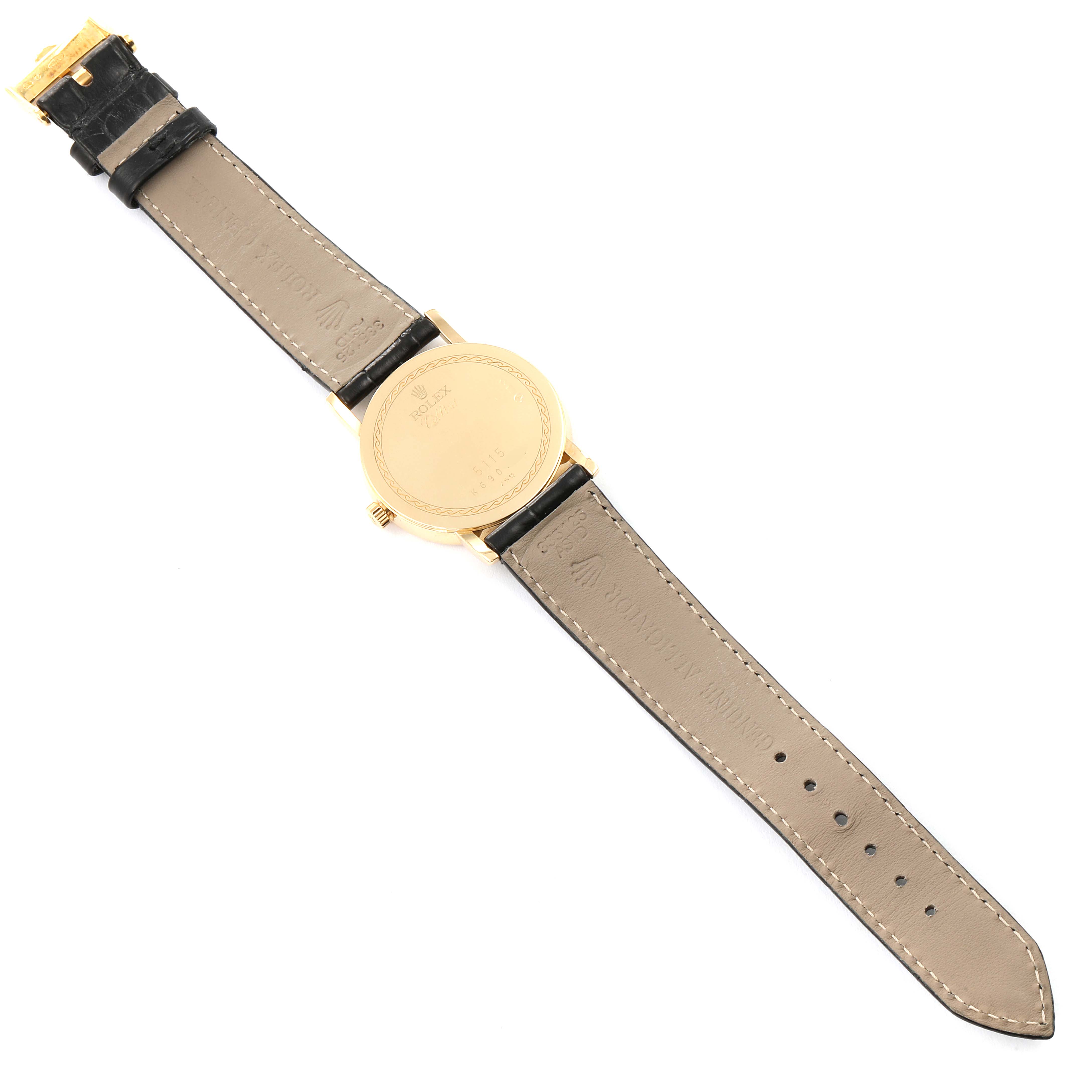 The image shows the back view of a Rolex Cellini 5115 Men's Yellow Gold Black Dial 5115 Men's Yellow Gold Black Dial watch, displaying its case back and leather strap.