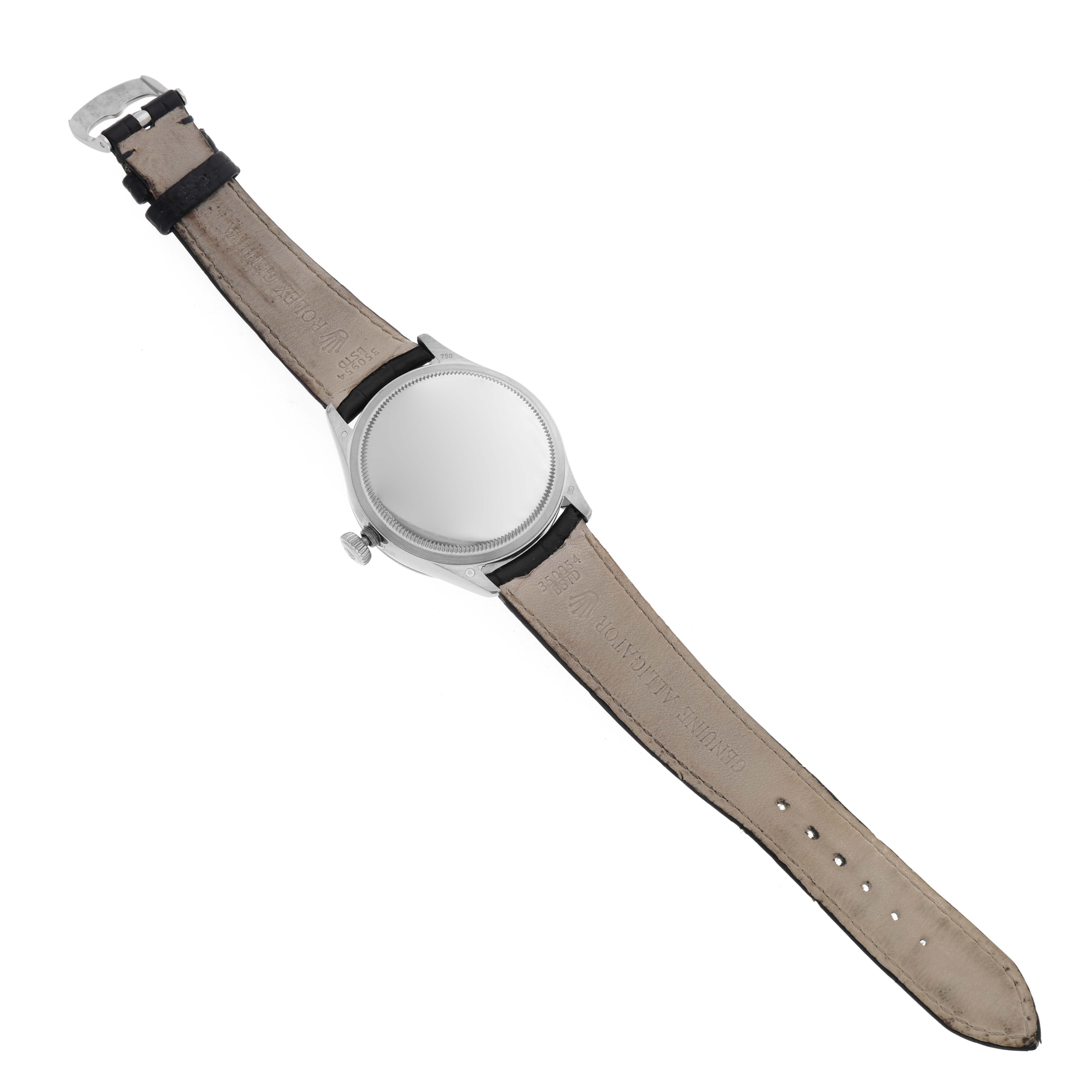 The image shows a top-down view of the back of a Rolex Cellini 50519 Men
s White Gold Blue Dial 50519 Men
s White Gold Blue Dial watch, displaying the leather strap and case back.