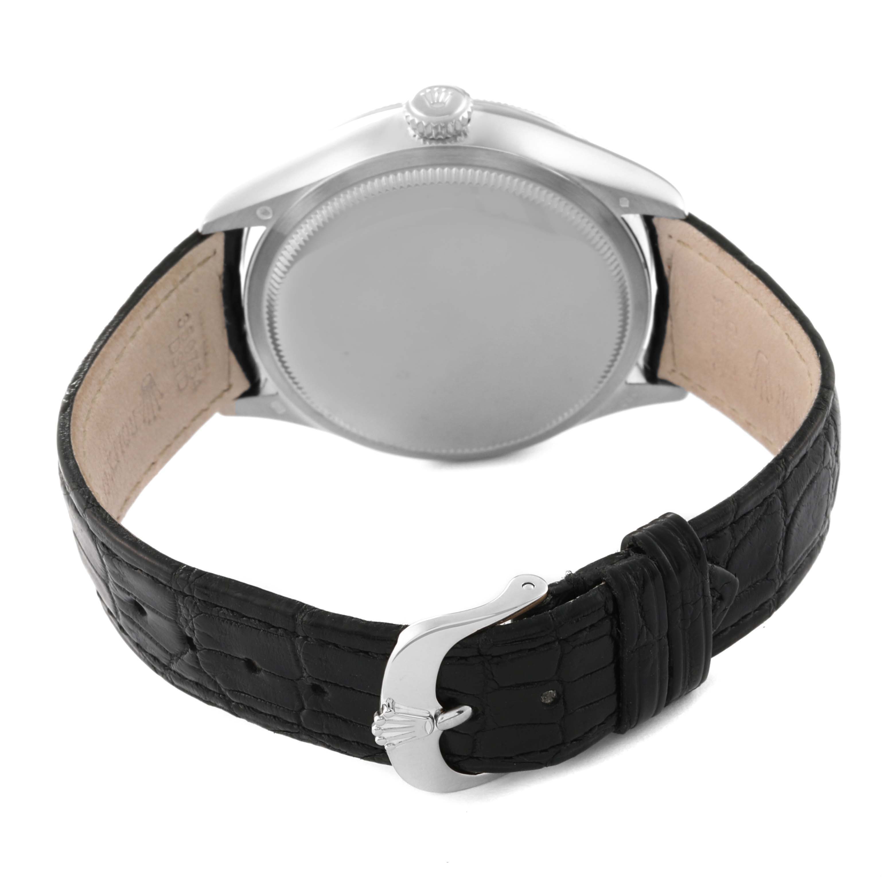 This image shows the back of a Rolex Cellini 50519 Men's White Gold Blue Dial 50519 Men's White Gold Blue Dial watch, featuring its case, crown, and black leather strap with the clasp.