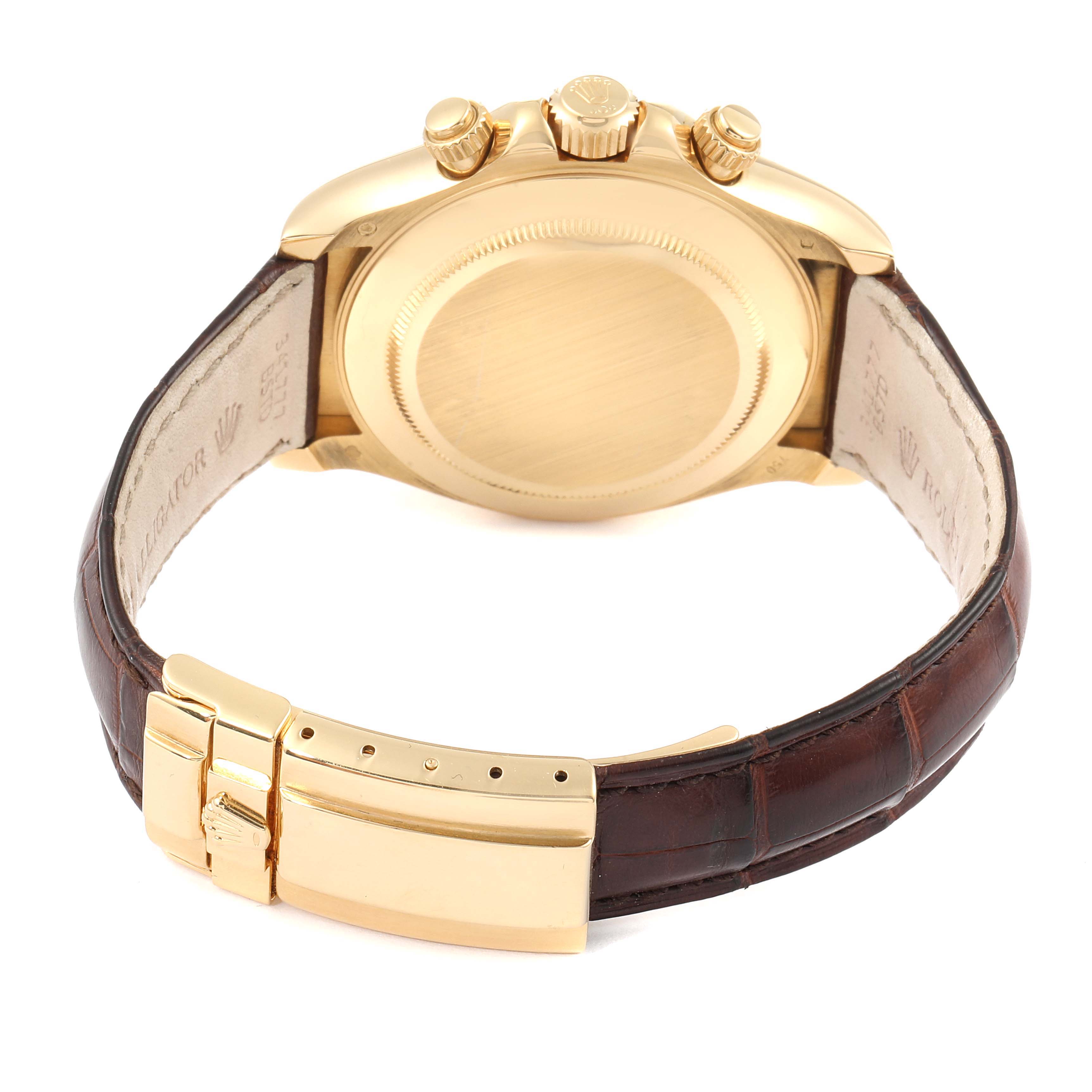 The image shows the back view of a Rolex Daytona 116518 Men's Yellow Gold Blue Dial 116518 Men's Yellow Gold Blue Dial watch, including its gold case, crown, and brown leather strap with a gold clasp.