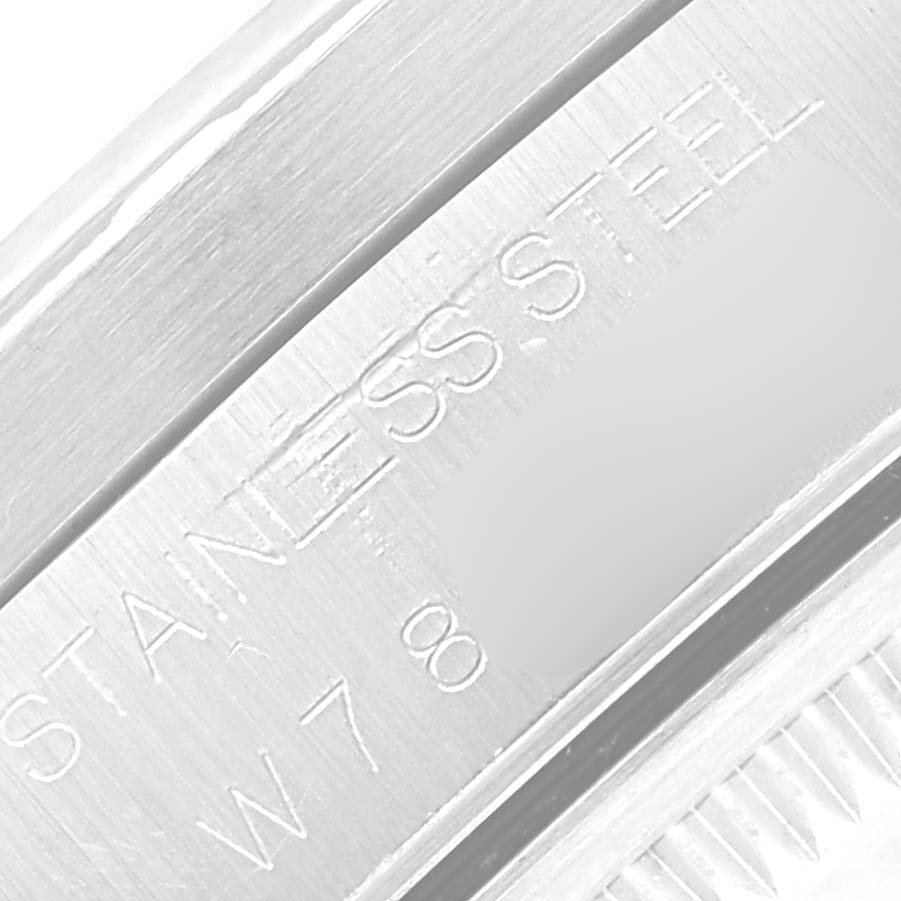 This is a close-up of the stainless steel casing with markings on a Rolex Date 15210 Men
s Stainless Steel Grey Dial 15210 Men
s Stainless Steel Grey Dial model watch.