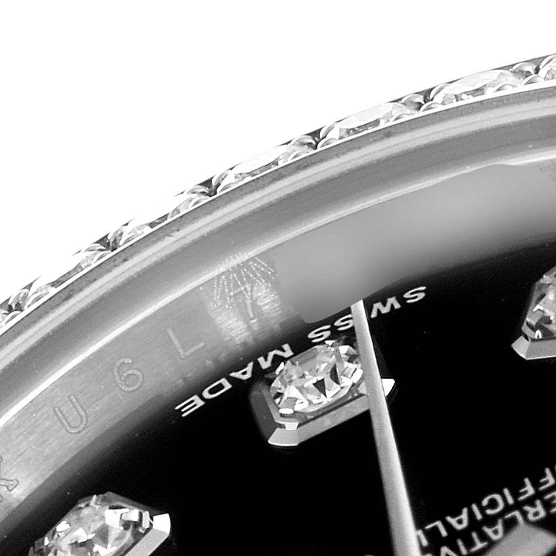 This close-up image of the Rolex Datejust 179384 Women's Stainless Steel Black Dial 179384 Women's Stainless Steel Black Dial watch shows a portion of the dial with diamond hour markers and part of the bezel.