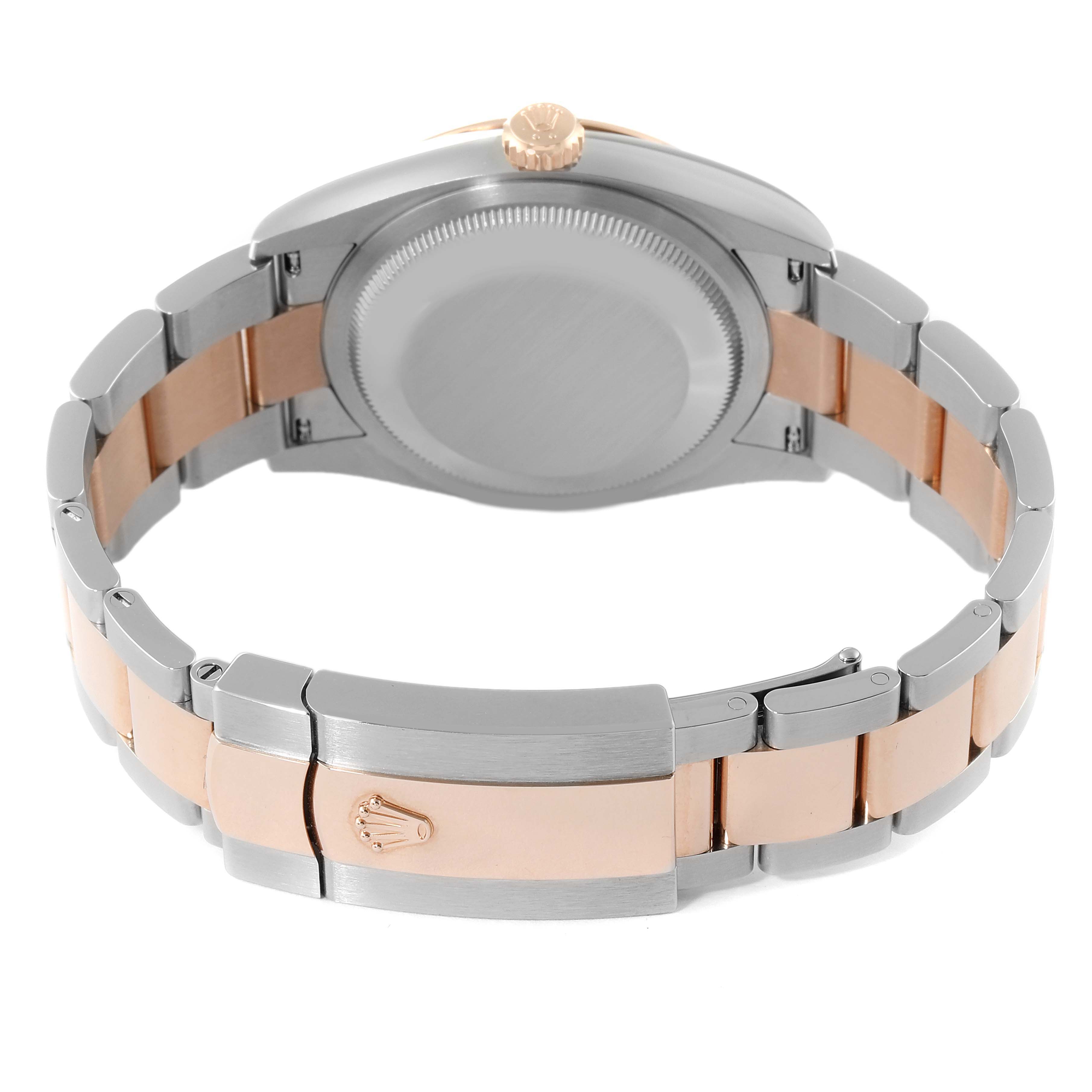 This image shows the back case and the two-tone bracelet of the Rolex Datejust 126201 Men's Steel and Gold (two tone) Silver Dial 126201 Men's Steel and Gold (two tone) Silver Dial watch, including the clasp with the Rolex logo.