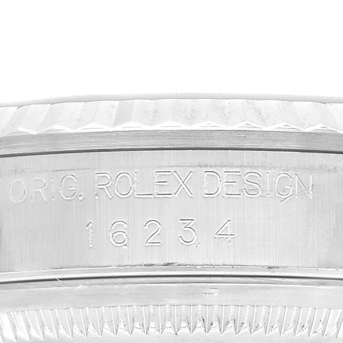 This image shows a close-up of the side of a Rolex Datejust 16234 Men's Stainless Steel Blue Dial 16234 Men's Stainless Steel Blue Dial watch, highlighting the "ORIG. ROLEX DESIGN" engraving and model number 16234.