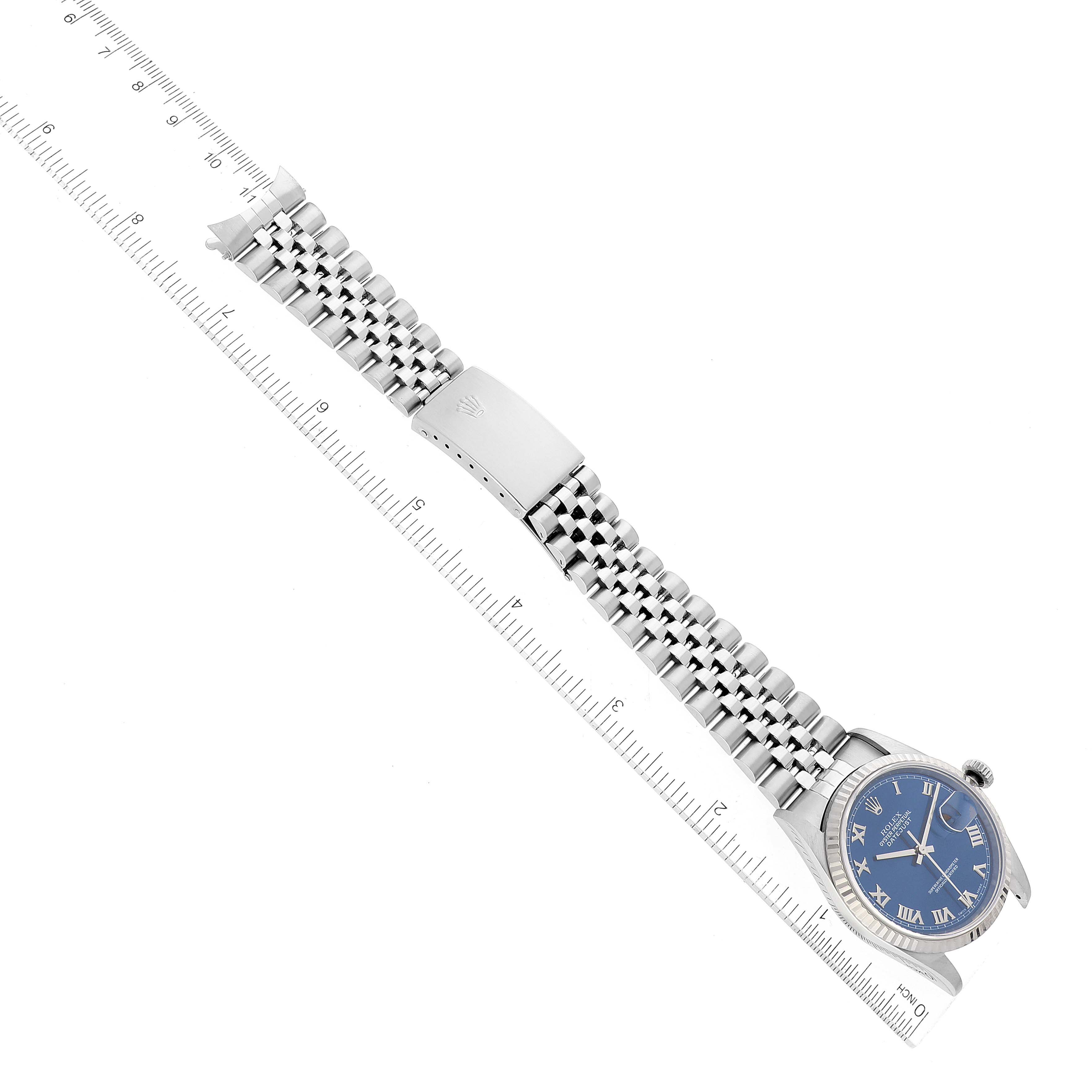 The image shows a Rolex Datejust 16234 Men's Stainless Steel Blue Dial 16234 Men's Stainless Steel Blue Dial watch at an angled top view, displaying its band, clasp, and part of the face with Roman numerals.
