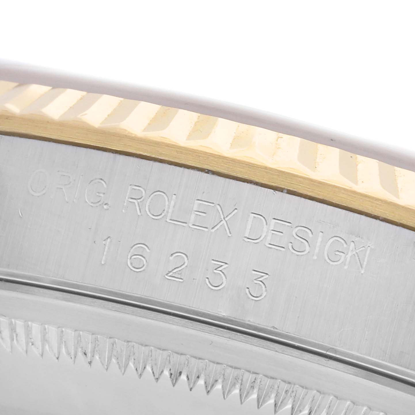 The image shows the side view of a Rolex Datejust 16233 Men's Steel and Gold (two tone) Champagne Dial 16233 Men's Steel and Gold (two tone) Champagne Dial case with "ORIG. ROLEX DESIGN 16233" engraved.