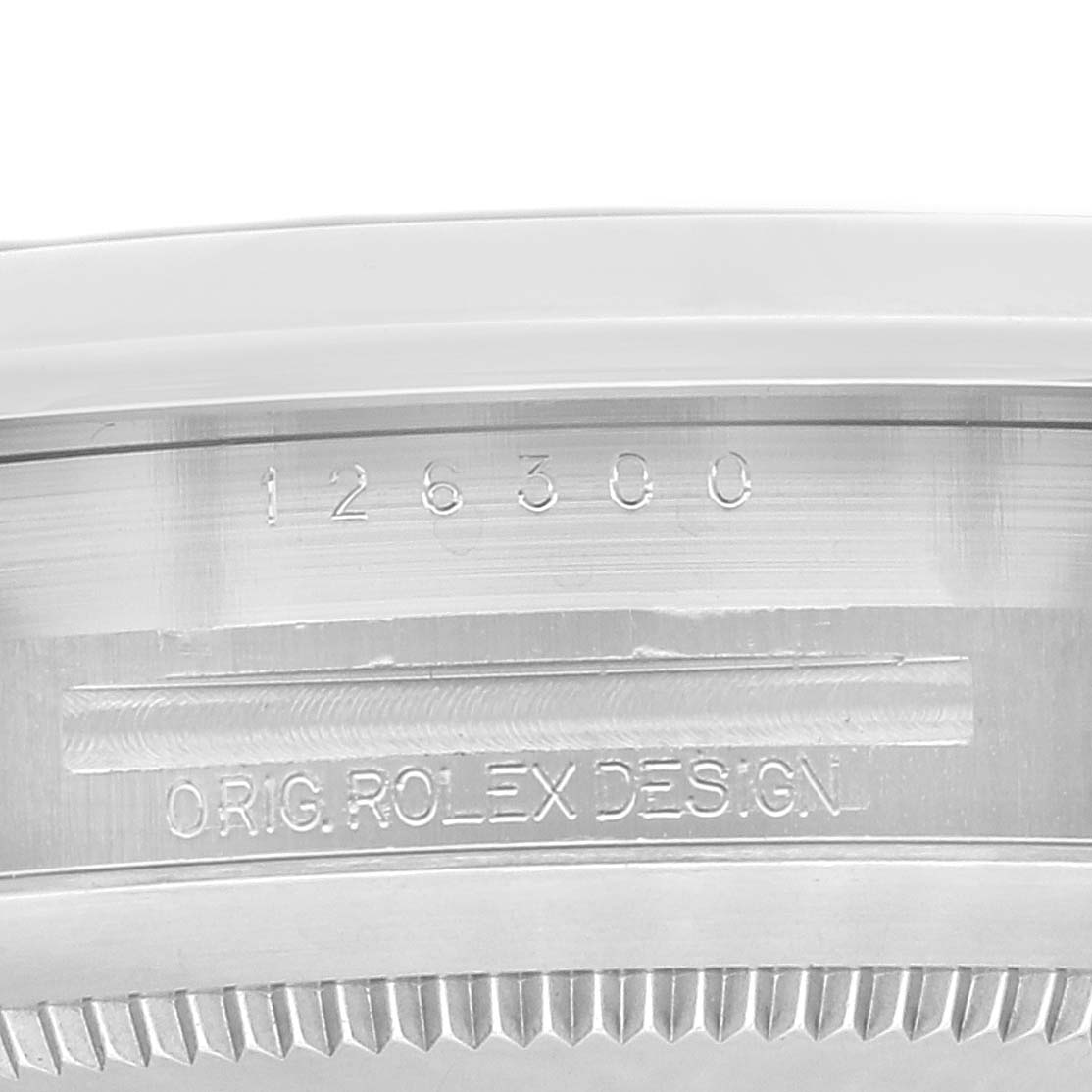 This is a close-up image showing the serial number and branding on the case of a Rolex Datejust 41 126300 Men
s Stainless Steel Blue Dial 126300 Men
s Stainless Steel Blue Dial model.