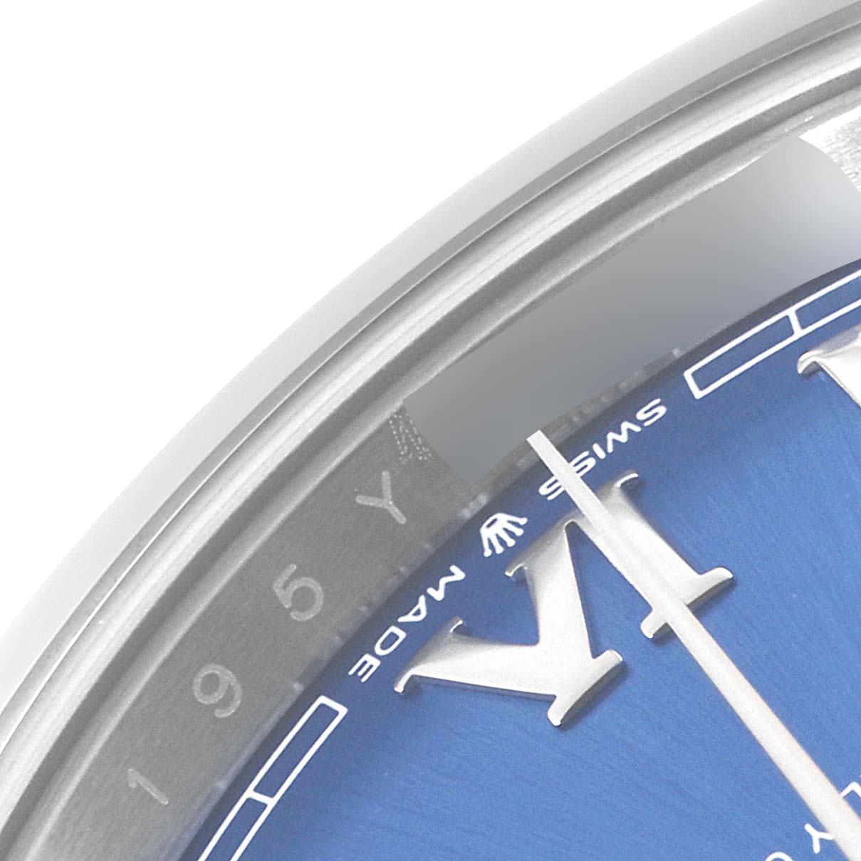 This is a close-up of the Rolex Datejust 41 126300 Men
s Stainless Steel Blue Dial 126300 Men
s Stainless Steel Blue Dial
s blue dial, showing the Roman numerals, part of the bezel, and the "Swiss Made" label.