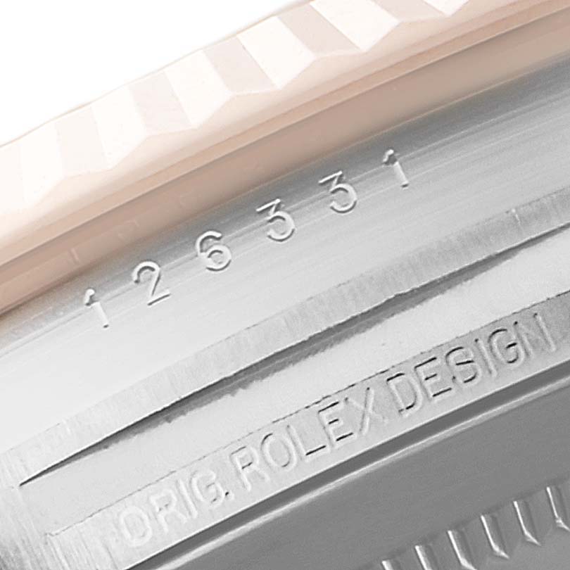 The image shows a close-up of the bezel and part of the case back of a Rolex Datejust 41 126331 Men's Steel and Gold (two tone) Brown Dial 126331 Men's Steel and Gold (two tone) Brown Dial watch, with the model number inscribed.