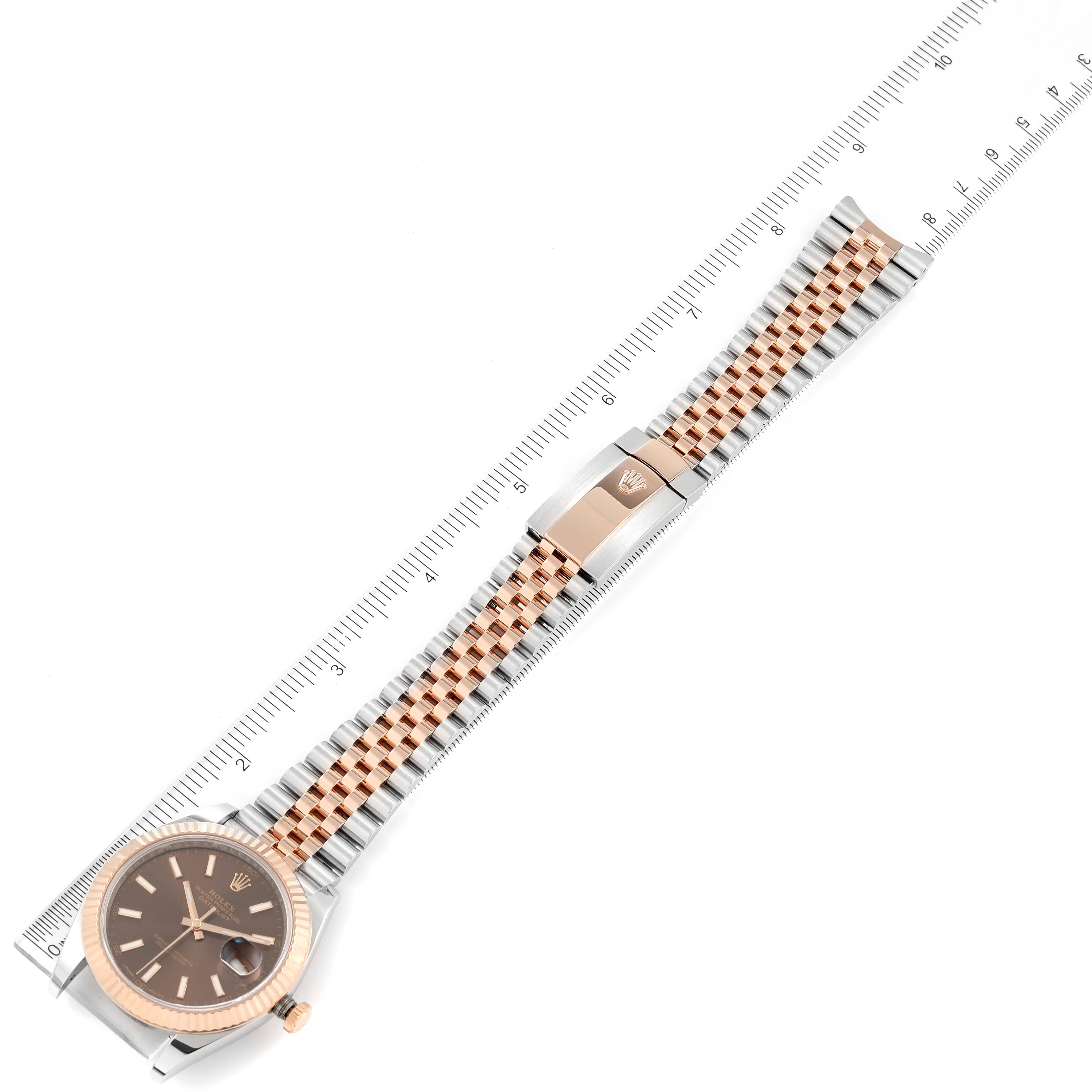 This image shows a top-down view of a Rolex Datejust 41 126331 Men's Steel and Gold (two tone) Brown Dial 126331 Men's Steel and Gold (two tone) Brown Dial watch, displaying the full length of the watch and its metal bracelet.