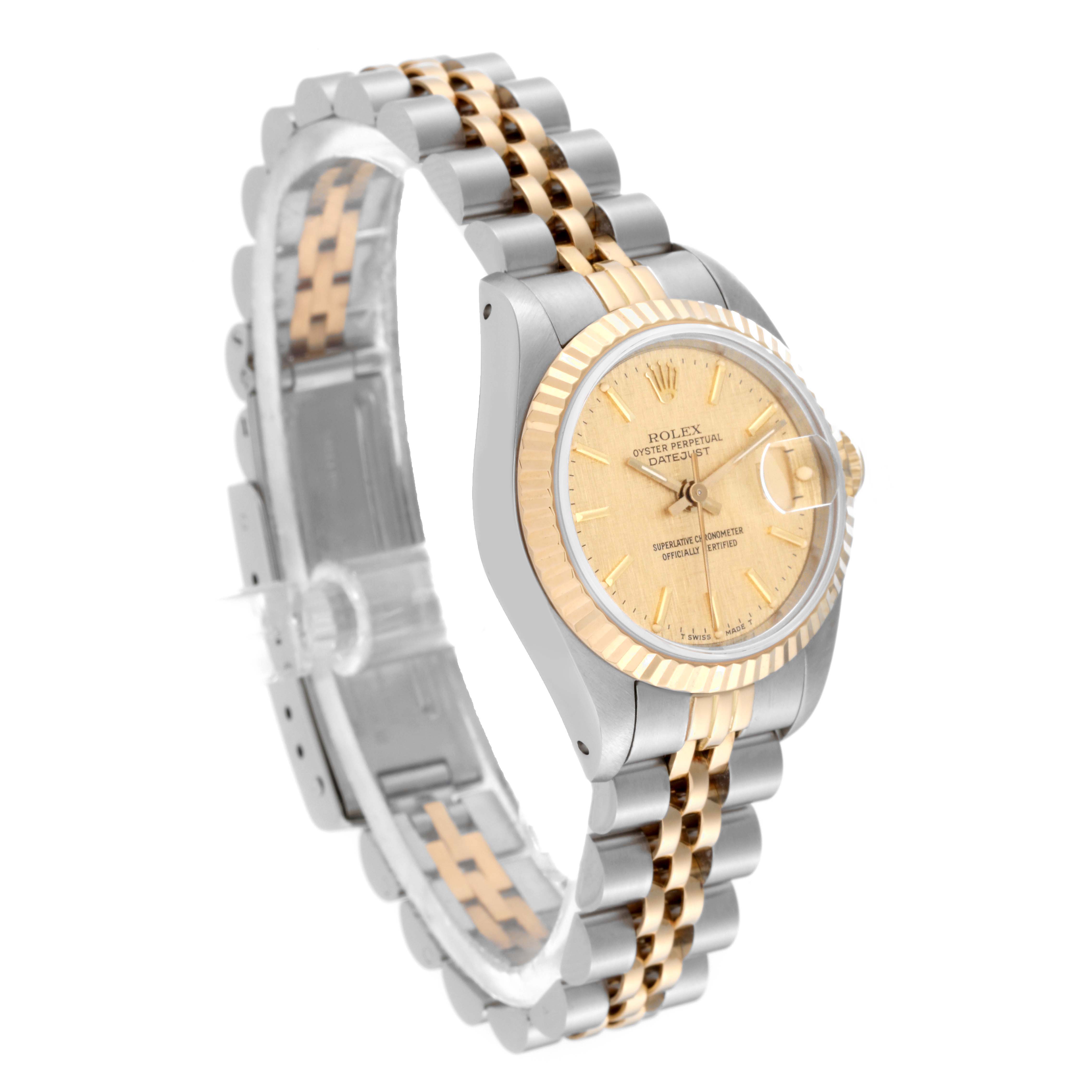 The image shows a Rolex Datejust 69173 Women's Steel and Gold (two tone) Champagne Dial 69173 Women's Steel and Gold (two tone) Champagne Dial watch from an angled side view, displaying the face, bezel, and bicolored bracelet.