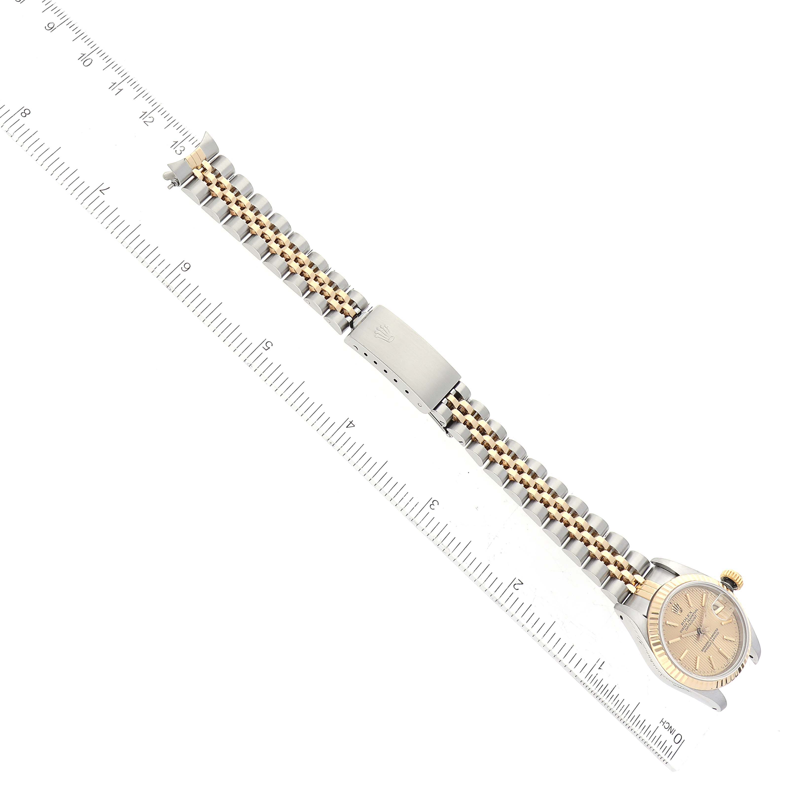 The image shows a Rolex Datejust 69173 Women's Steel and Gold (two tone) Champagne Dial 69173 Women's Steel and Gold (two tone) Champagne Dial watch laid flat from above, with its full bracelet and clasp visible next to a ruler.