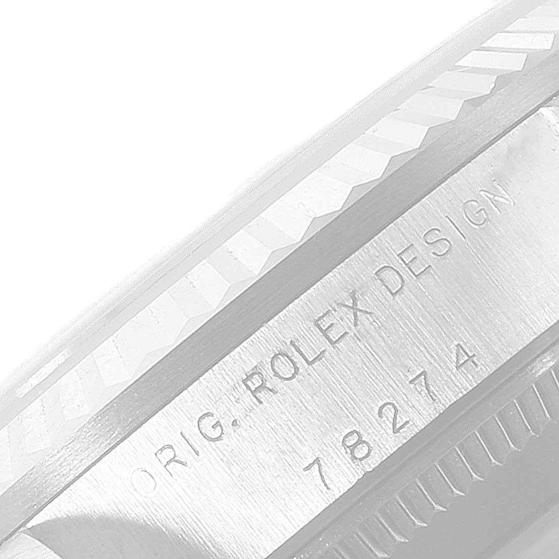 This image shows a close-up angle of the engraved side of a Mid-Size Rolex watch case with the text "ORIG. ROLEX DESIGN 78274."