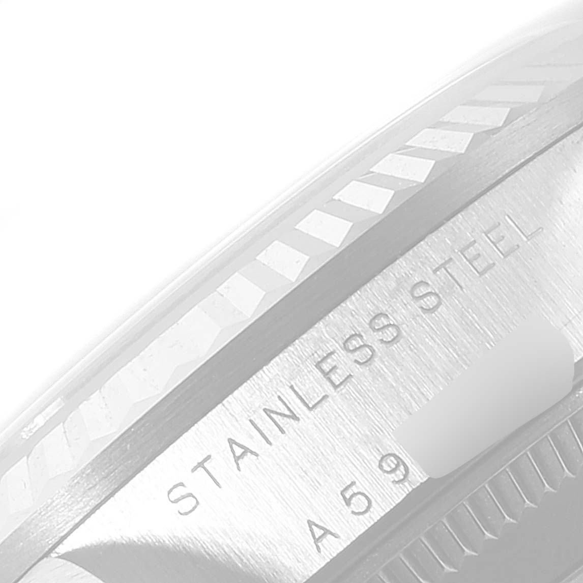 The image shows a close-up of the side of a Rolex Mid-Size 78274 Women
s Stainless Steel White Dial 78274 Women
s Stainless Steel White Dial watch case, highlighting the stainless steel material and part of the serial number.