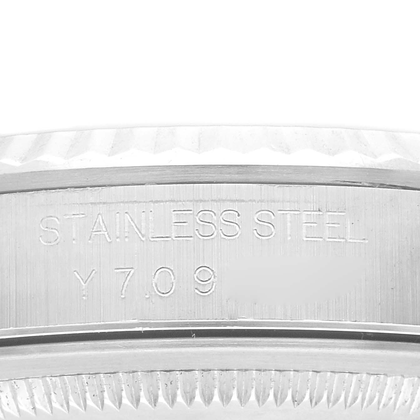This image shows a close-up view of the stainless steel case and serial number on a Rolex Datejust 16234 Men's Stainless Steel Silver Dial 16234 Men's Stainless Steel Silver Dial watch.