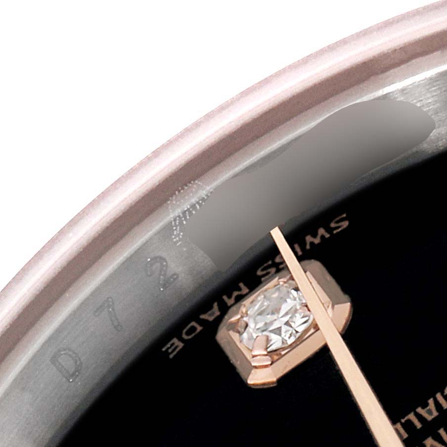 The image shows a close-up of the bezel and part of the dial of a Rolex Datejust 179171 Women
s Steel and Gold (two tone) Black Dial 179171 Women
s Steel and Gold (two tone) Black Dial.