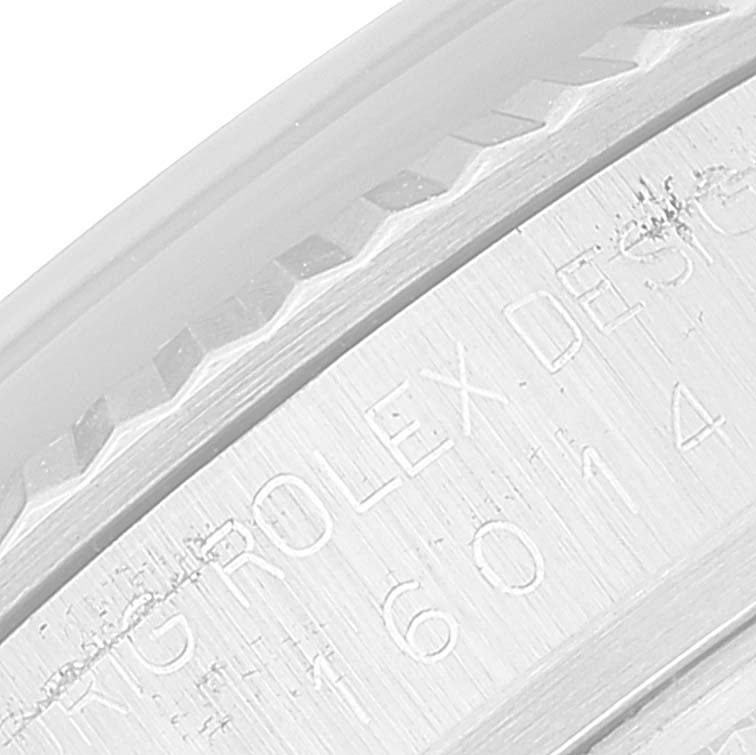 The image shows a close-up of the engraved serial number and design details on the bezel of the Rolex Vintage Collection 16014 Men's Stainless Steel Silver Dial 16014 Men's Stainless Steel Silver Dial watch.