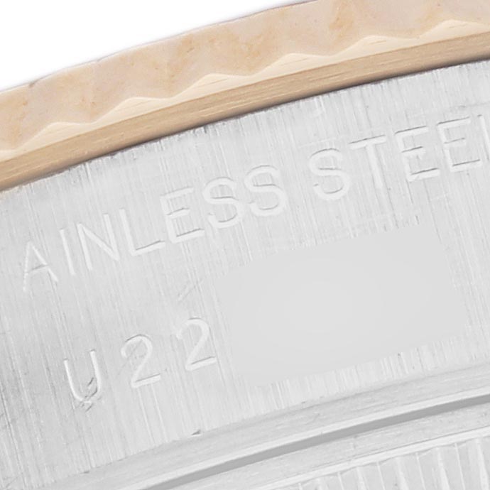 The image shows a close-up of the edge and case back of a Rolex Datejust 69173 Women's Steel and Gold (two tone) Champagne Dial 69173 Women's Steel and Gold (two tone) Champagne Dial, highlighting the fluted bezel.