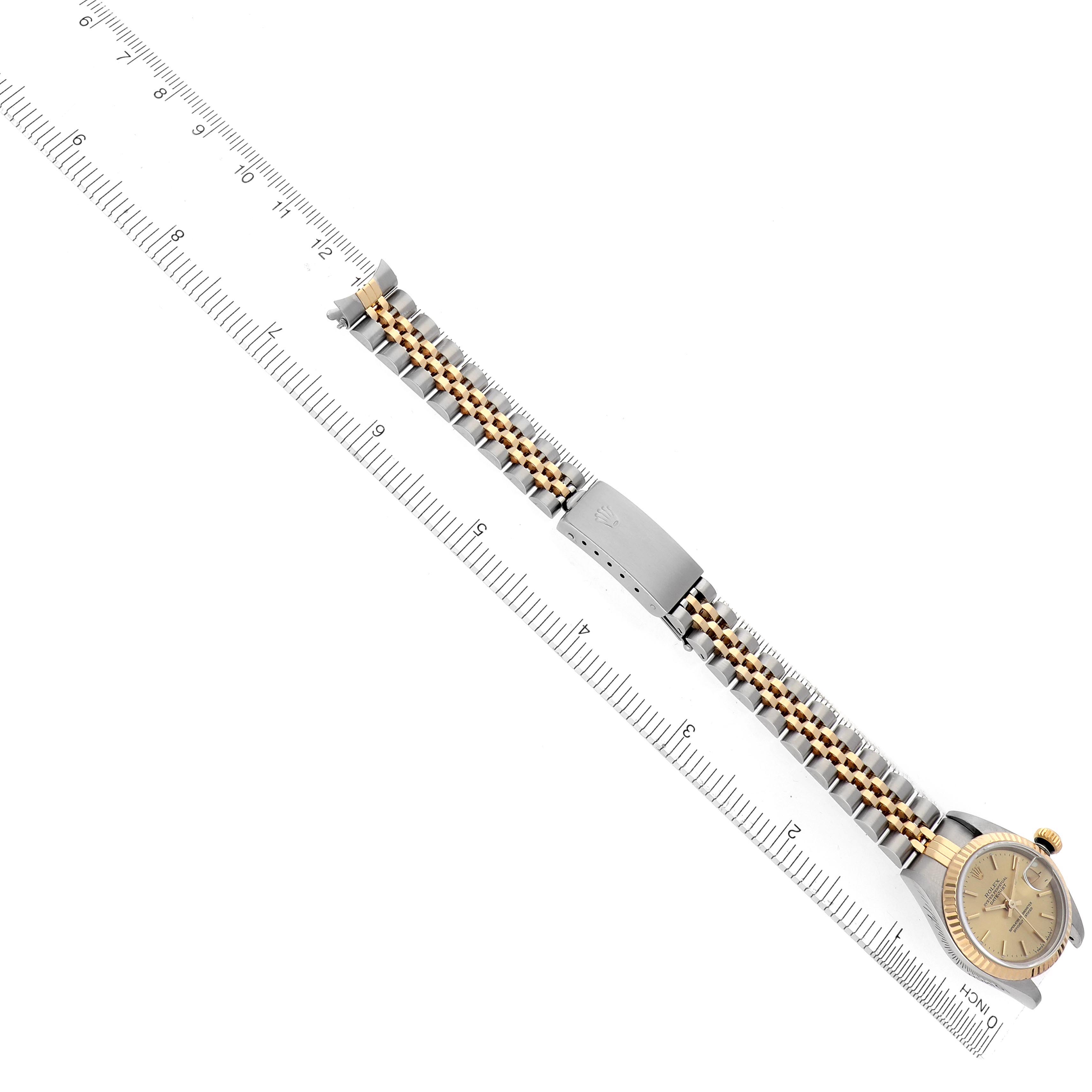 The Rolex Datejust 69173 Women's Steel and Gold (two tone) Champagne Dial 69173 Women's Steel and Gold (two tone) Champagne Dial is shown at an angled top view, displaying the full watch with a focus on its bracelet and clasp.