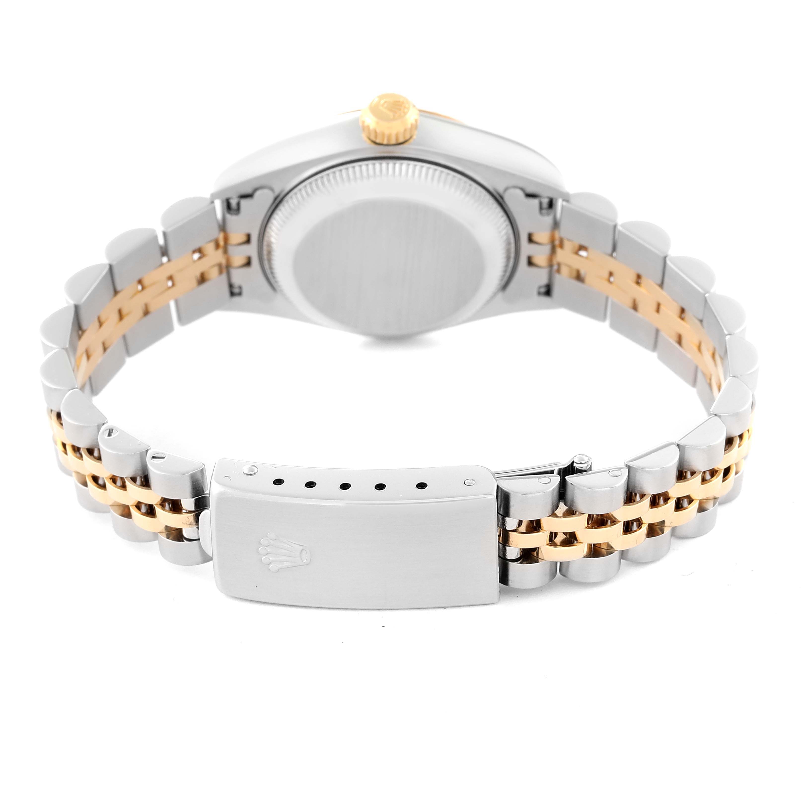 The image shows the back case and clasp of a Rolex Datejust 79173 Women's Steel and Gold (two tone) Champagne Dial 79173 Women's Steel and Gold (two tone) Champagne Dial watch, highlighting its two-tone metal bracelet.