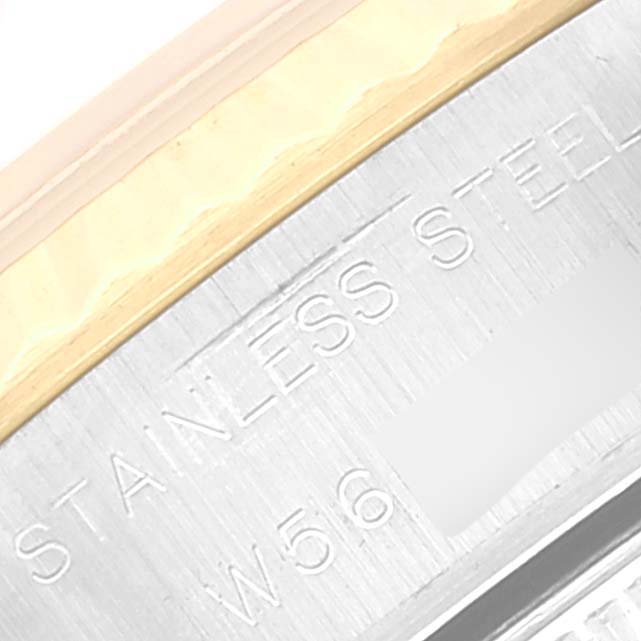 The image shows a close-up of the stainless steel and gold bezel with part of the serial number of a Rolex Datejust 69173 Women's Steel and Gold (two tone) Champagne Dial 69173 Women's Steel and Gold (two tone) Champagne Dial watch.