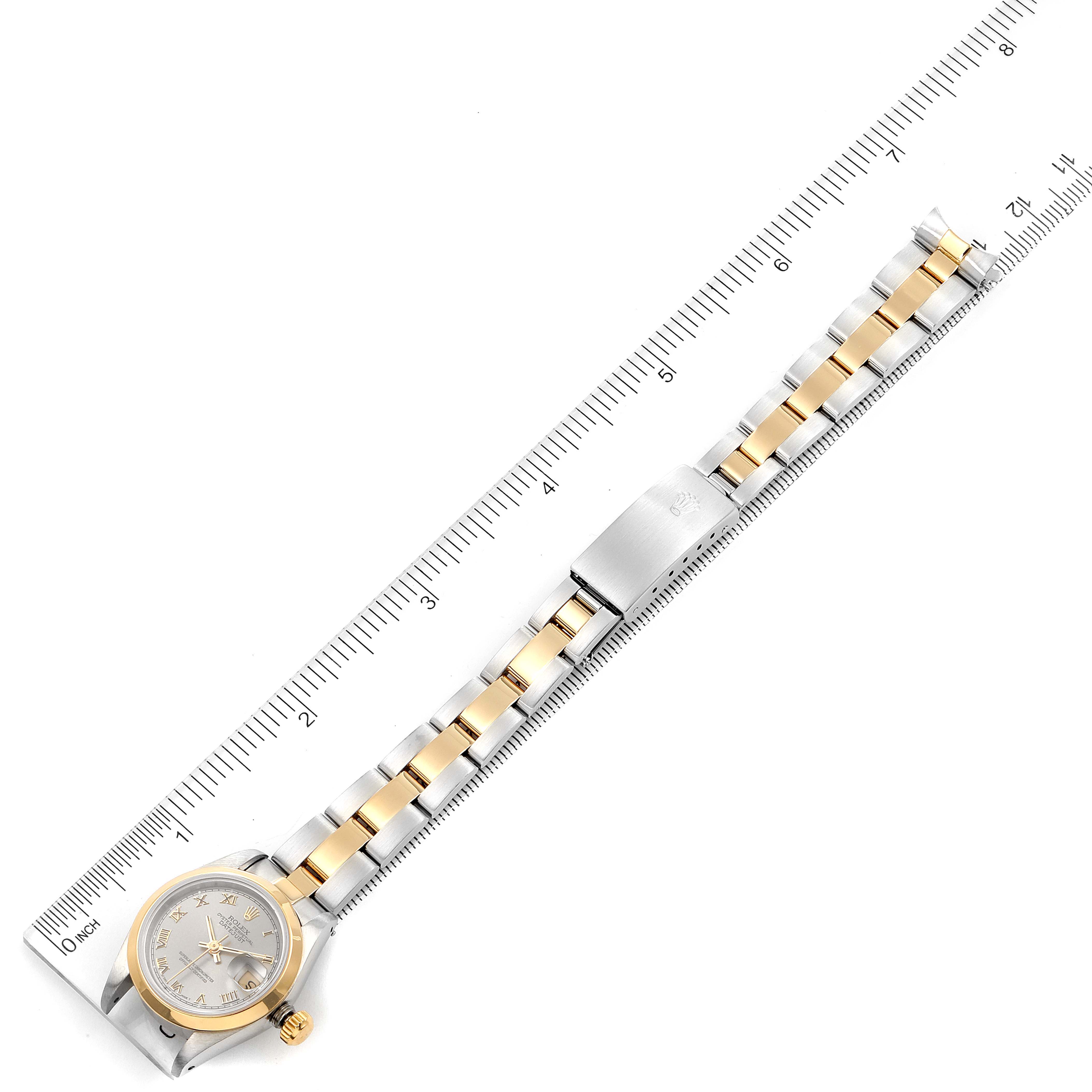 The image shows a top view of a Rolex Datejust 69163 Women's Steel and Gold (two tone) Grey Dial 69163 Women's Steel and Gold (two tone) Grey Dial model watch, highlighting the face and bracelet using a ruler for scale.