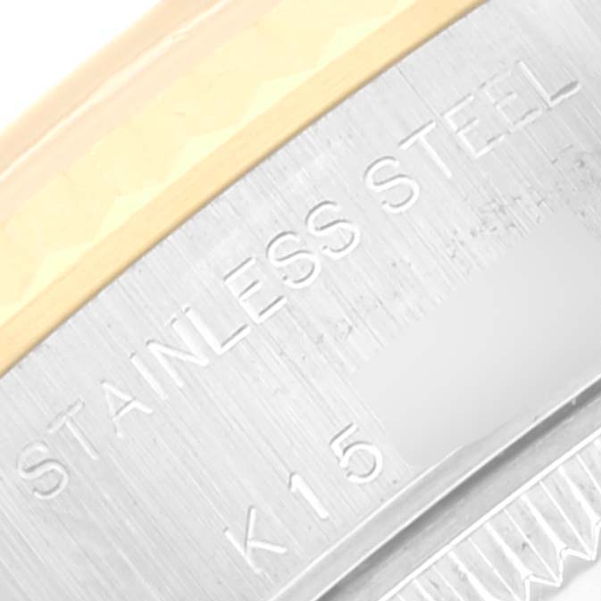 The image shows a close-up of the edge of the case back, revealing 'STAINLESS STEEL' text on a Rolex Datejust 79173 Women's Steel and Gold (two tone) White Dial 79173 Women's Steel and Gold (two tone) White Dial model.