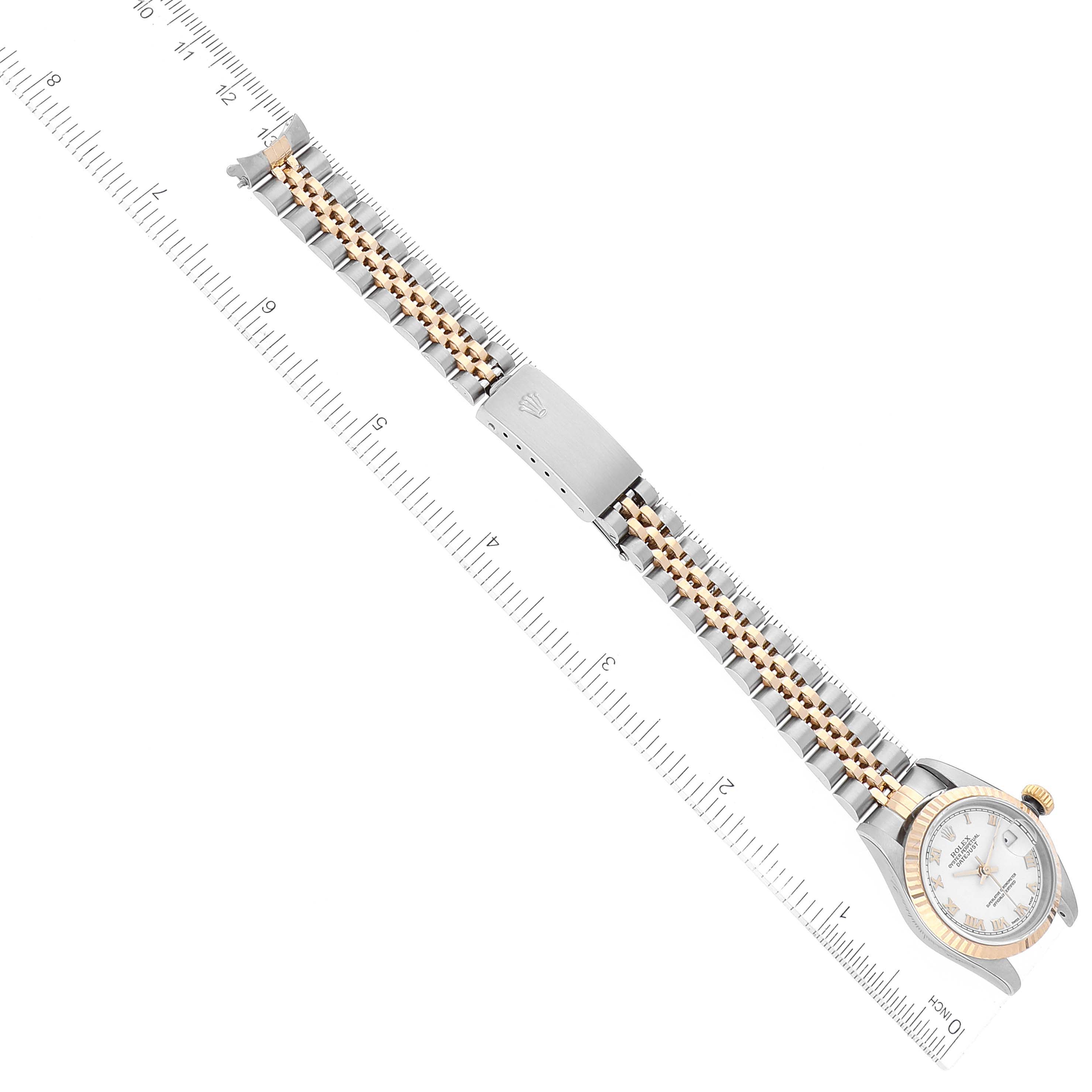 The Rolex Datejust 79173 Women's Steel and Gold (two tone) White Dial 79173 Women's Steel and Gold (two tone) White Dial watch is shown at a diagonal angle, displaying the bracelet, clasp, and partial case with measurements.