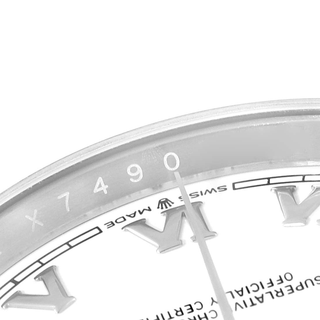 This image shows a close-up of the Rolex Datejust 126200 Men's Stainless Steel White Dial 126200 Men's Stainless Steel White Dial watch's dial and part of the bezel, displaying the serial number.