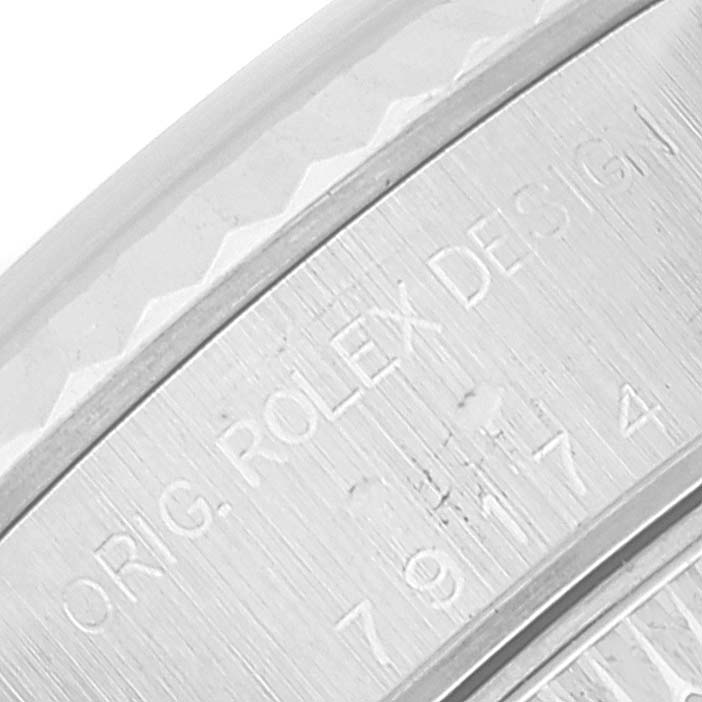 This close-up image shows the engraved details on the case back of a Rolex Datejust 79174 Women's Stainless Steel Mother of Pearl Dial 79174 Women's Stainless Steel Mother of Pearl Dial watch.