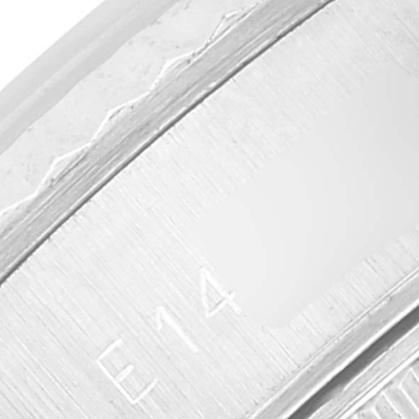 This is a close-up image of the engraved bezel edge of a Rolex Datejust 69174 Women's Stainless Steel Silver Dial 69174 Women's Stainless Steel Silver Dial watch.