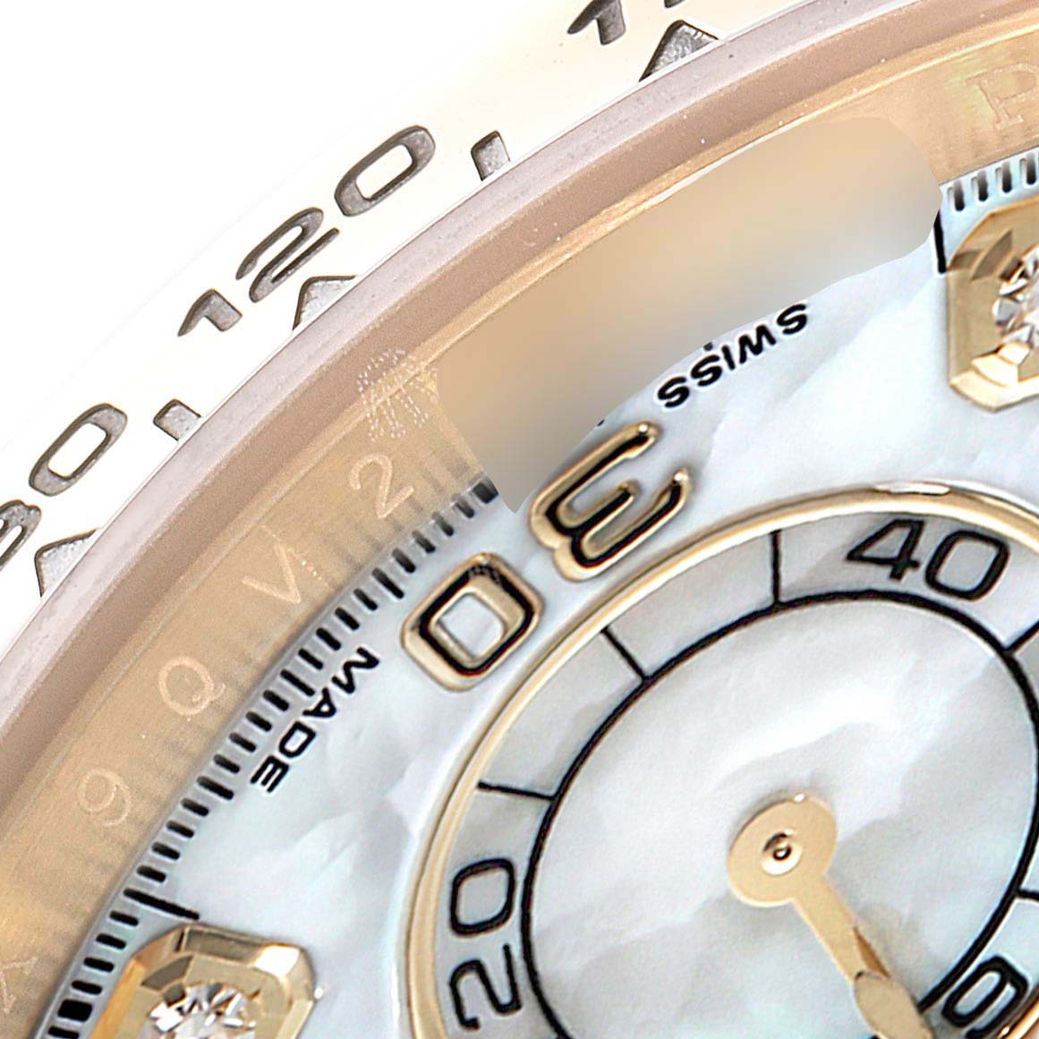 This image shows a close-up of the dial, bezel, and part of the subdial of a Rolex Daytona 116508 Men's Yellow Gold Mother of Pearl Dial 116508 Men's Yellow Gold Mother of Pearl Dial watch model.